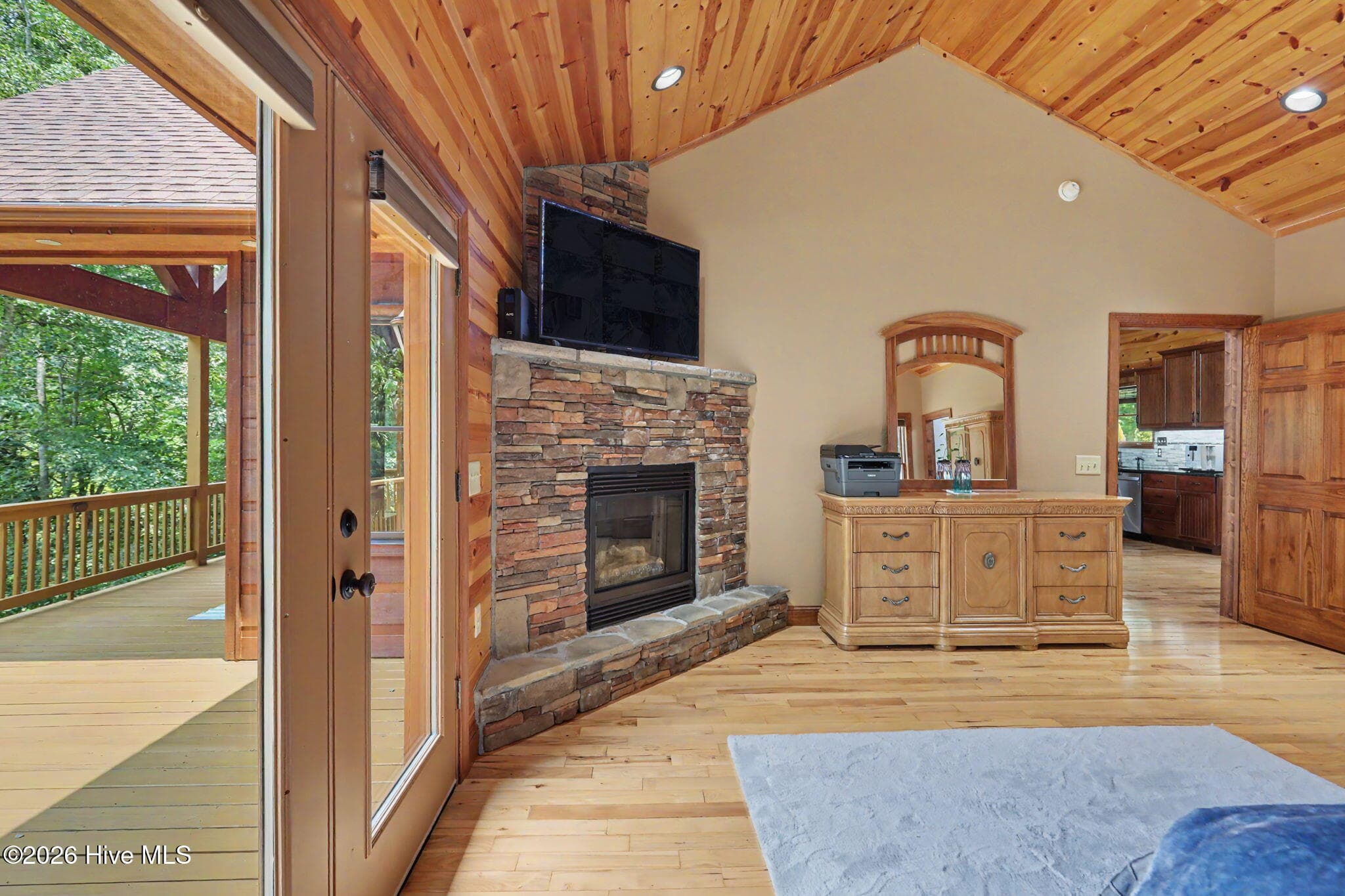 Fireplace and French doors make the primary suite a retreat of its own. - 210 Majestic Drive, Hayesville, NC 28904