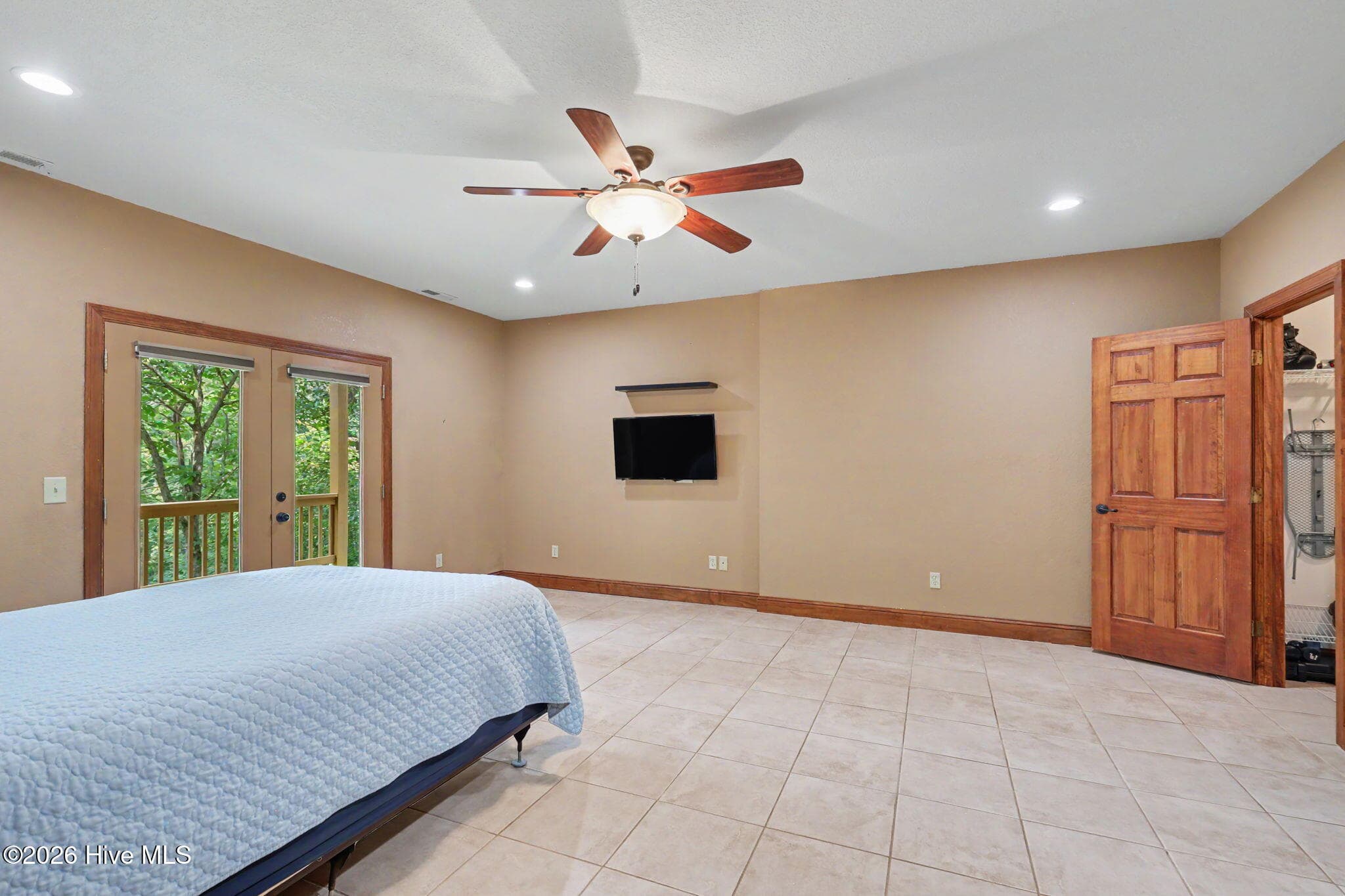 Second lower-level bedroom offers generous space and privacy. - 210 Majestic Drive, Hayesville, NC 28904