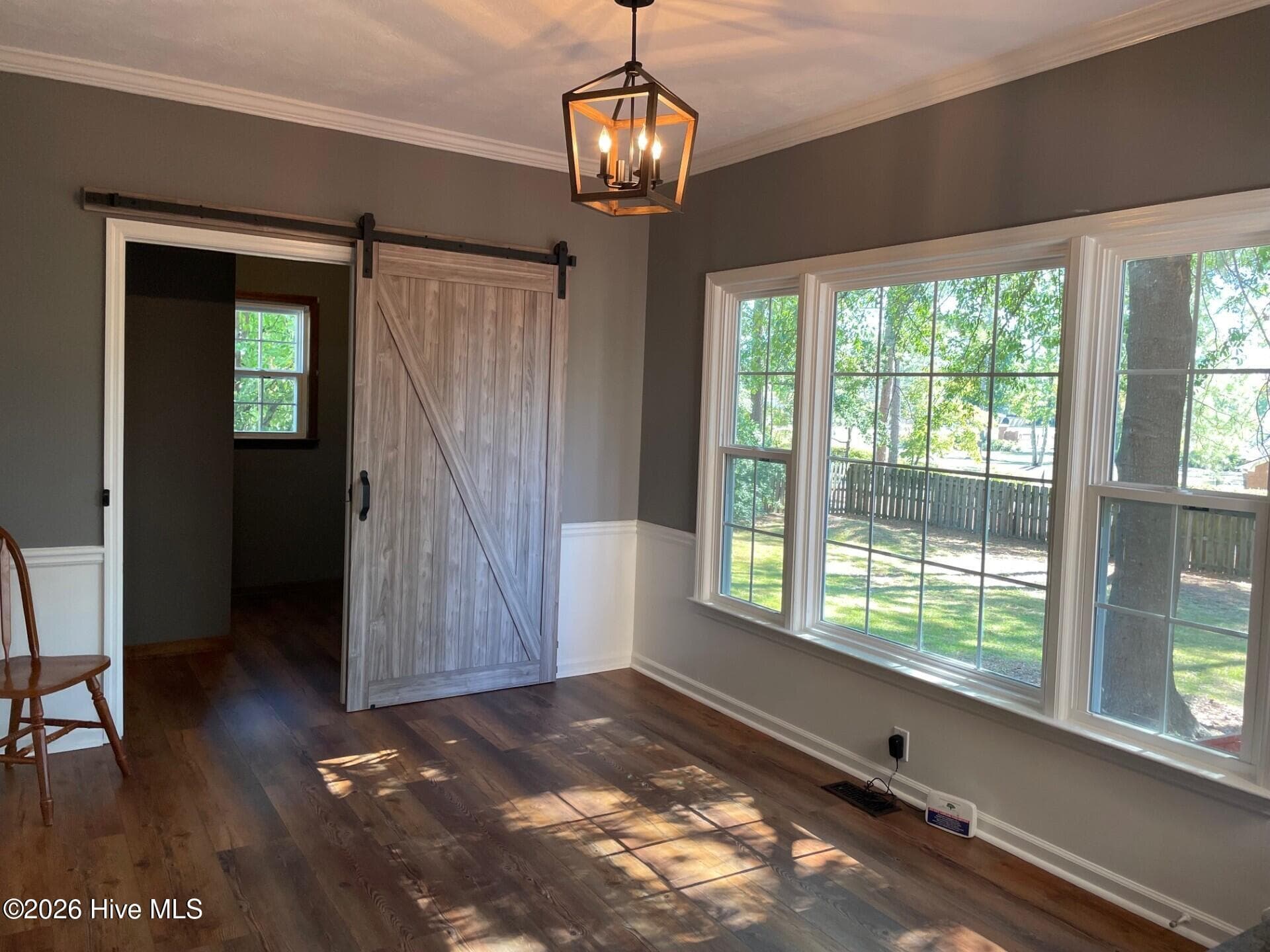 Sunny breakfast room with brand new beautiful LVP flooring. Barn door slider leads to pantry shelving and laundry room. - 4164 Quail Springs Circle, Augusta, GA 30907