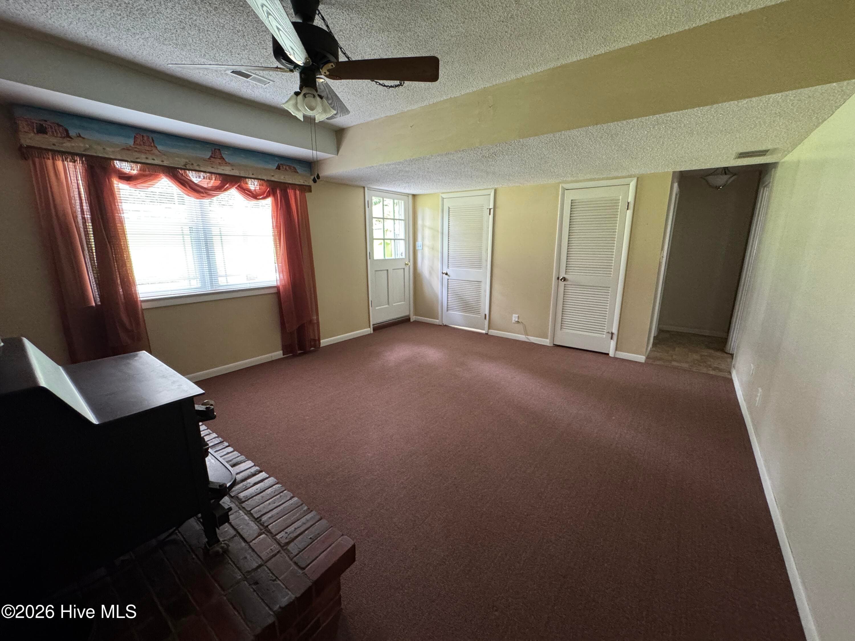 View in the Family room of the Mud Room, AC access and a closet. - 118 Oakwood Drive, Havelock, NC 28532