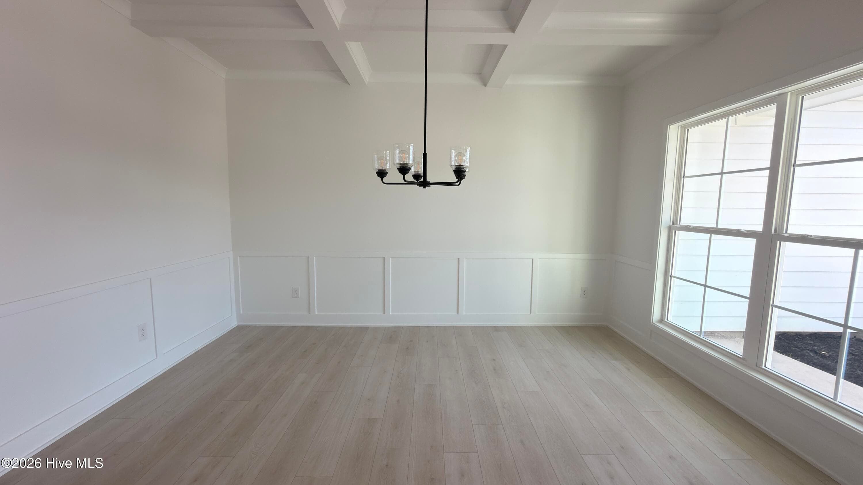 Formal dining room with coffered ceiling - 2129 Sandbrook Loop, Leland, NC 28451