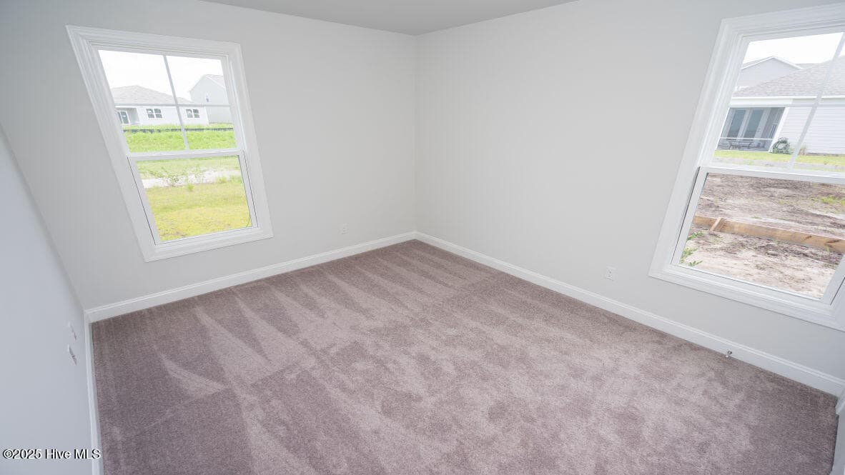 Photo is similar to actual home. Home is currently under construction. Features, colors and options may be different from those shown in representative photos. Call for detailed information. - 3221 Butterfly Ginger Street Lot 74, Leland, NC 28451
