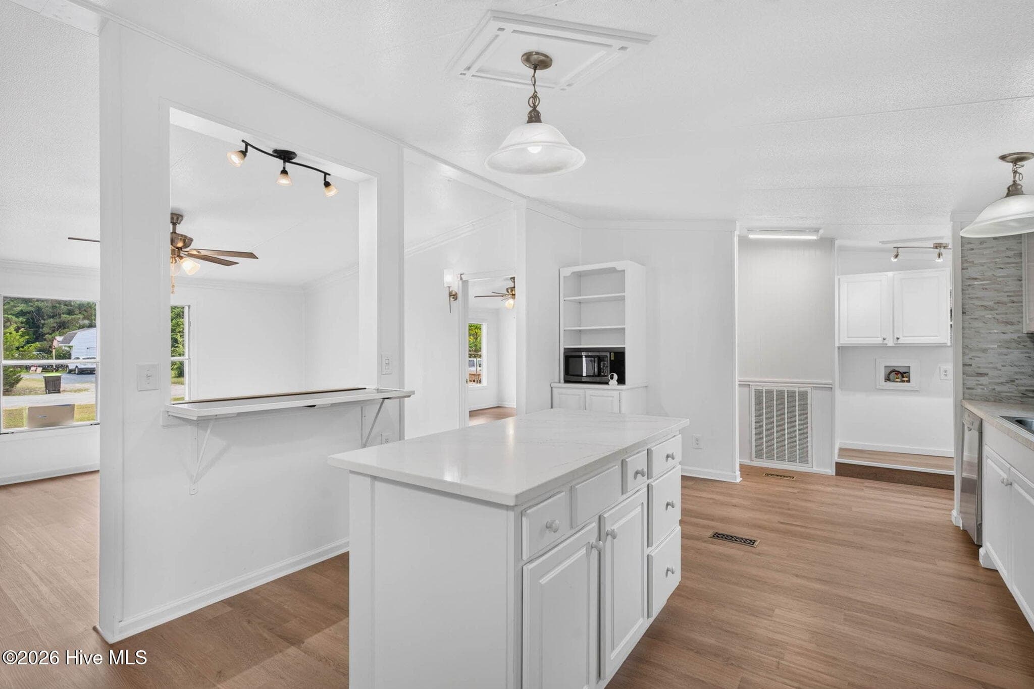 Bright, functional kitchen with abundant cabinetry, updated finishes, and an open layout that keeps you connected to the rest of the home. - 1199 Zack Street SE, Bolivia, NC 28422