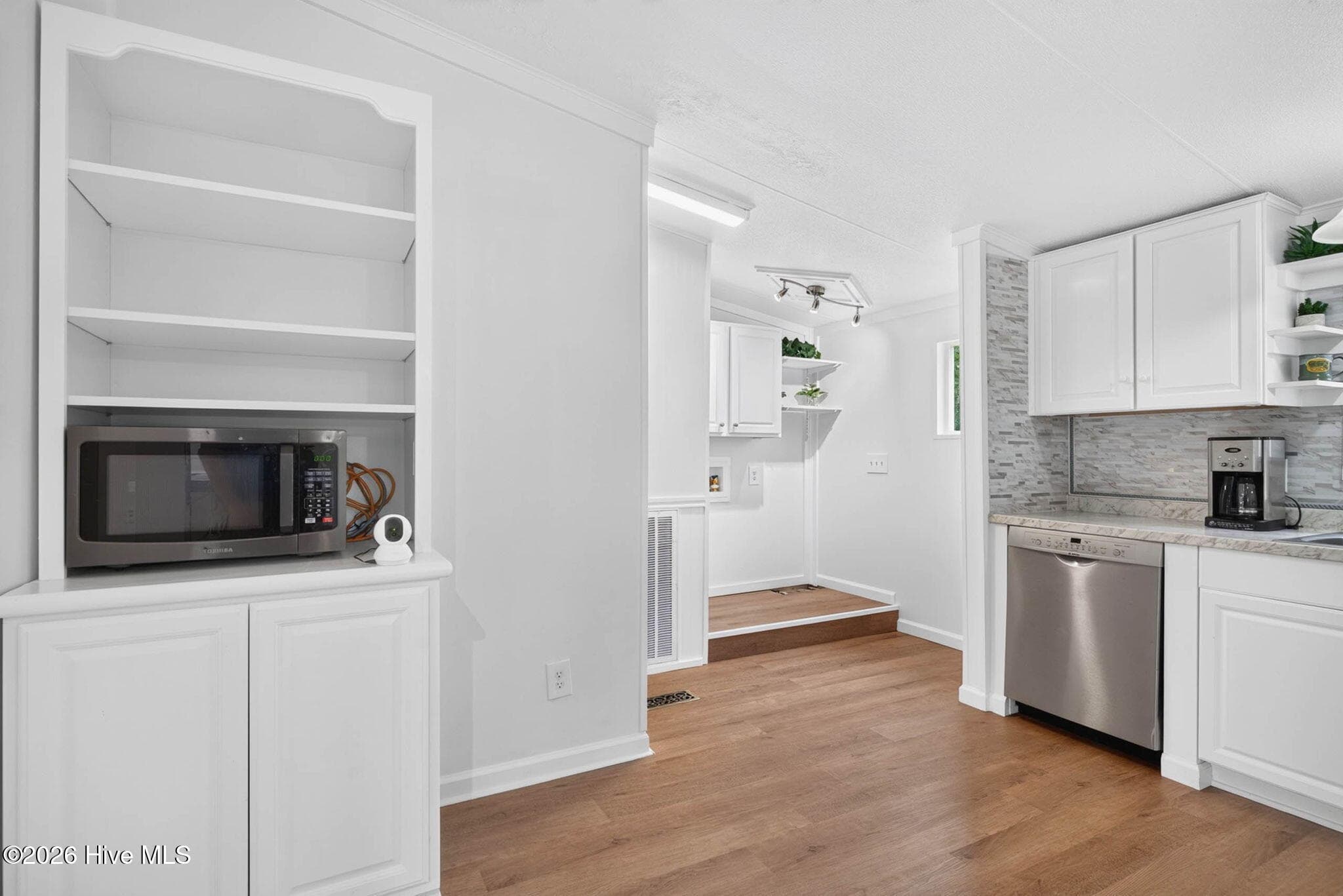Convenient built-in pantry and shelving provide excellent storage and organization just steps from the kitchen. - 1199 Zack Street SE, Bolivia, NC 28422
