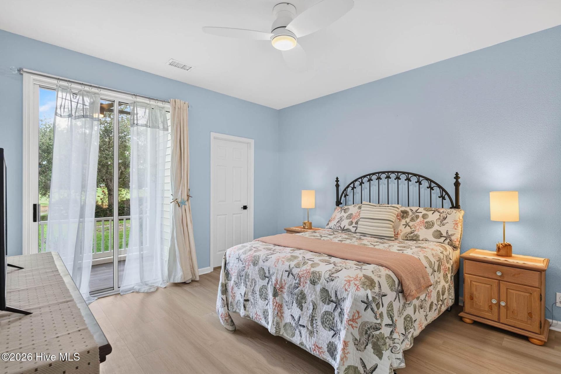 Primary Bedroom overlooks porch - 874 Great Egret Circle SW 7a, Sunset Beach, NC 28468