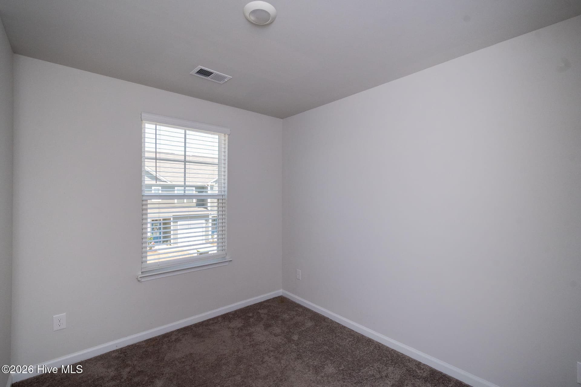 Bedroom 1 looking towards the street - 7619 Knightbell Circle, Leland, NC 28451