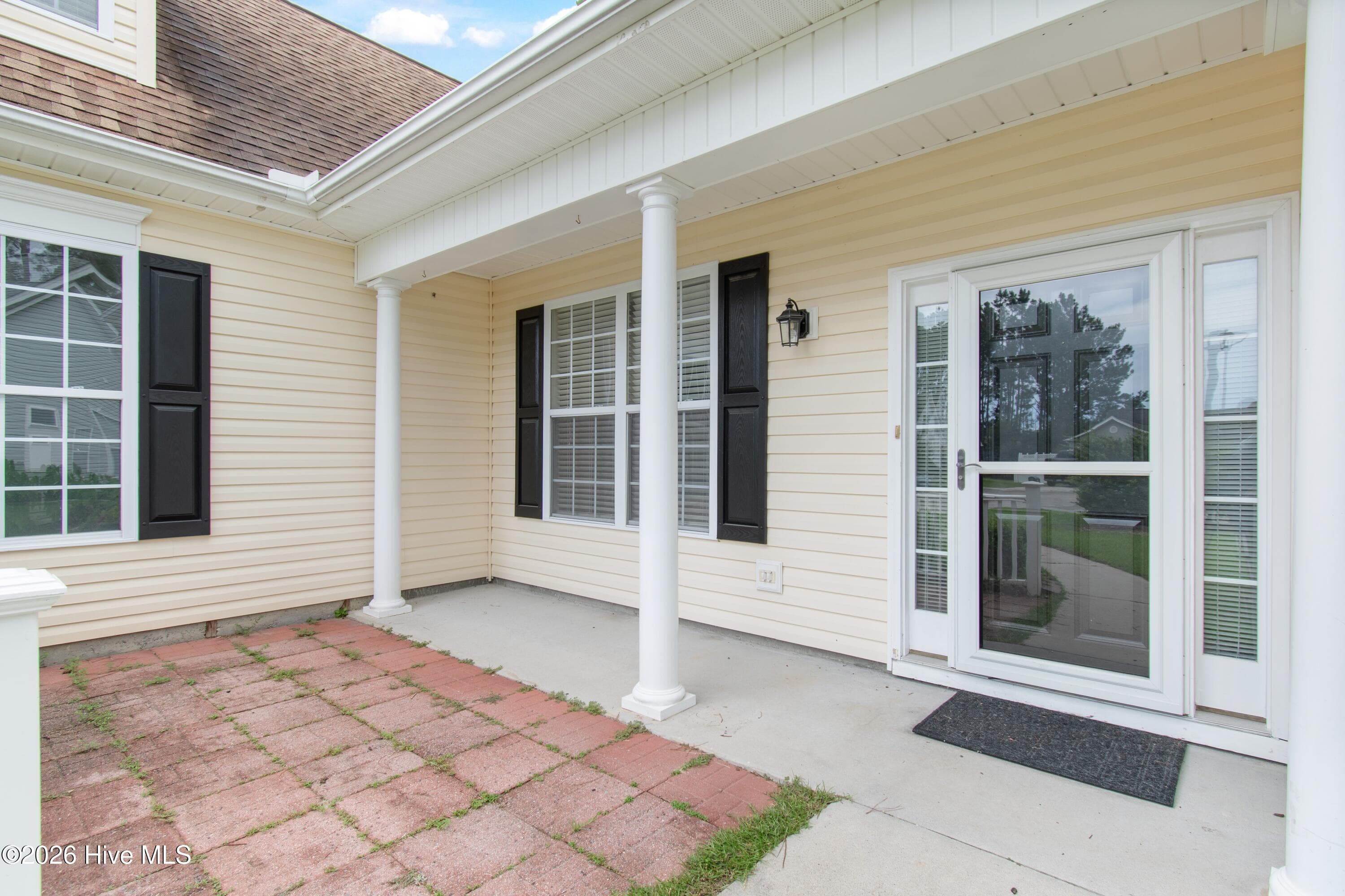 Entrance to home with paver patio. - 709 E Pipers Glen, Shallotte, NC 28470
