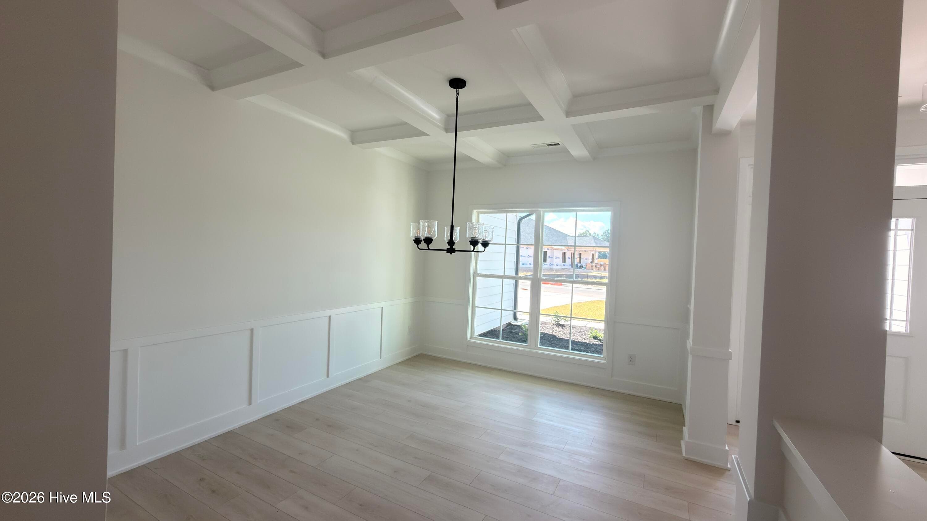 Formal dining room with coffered ceiling - 2129 Sandbrook Loop, Leland, NC 28451