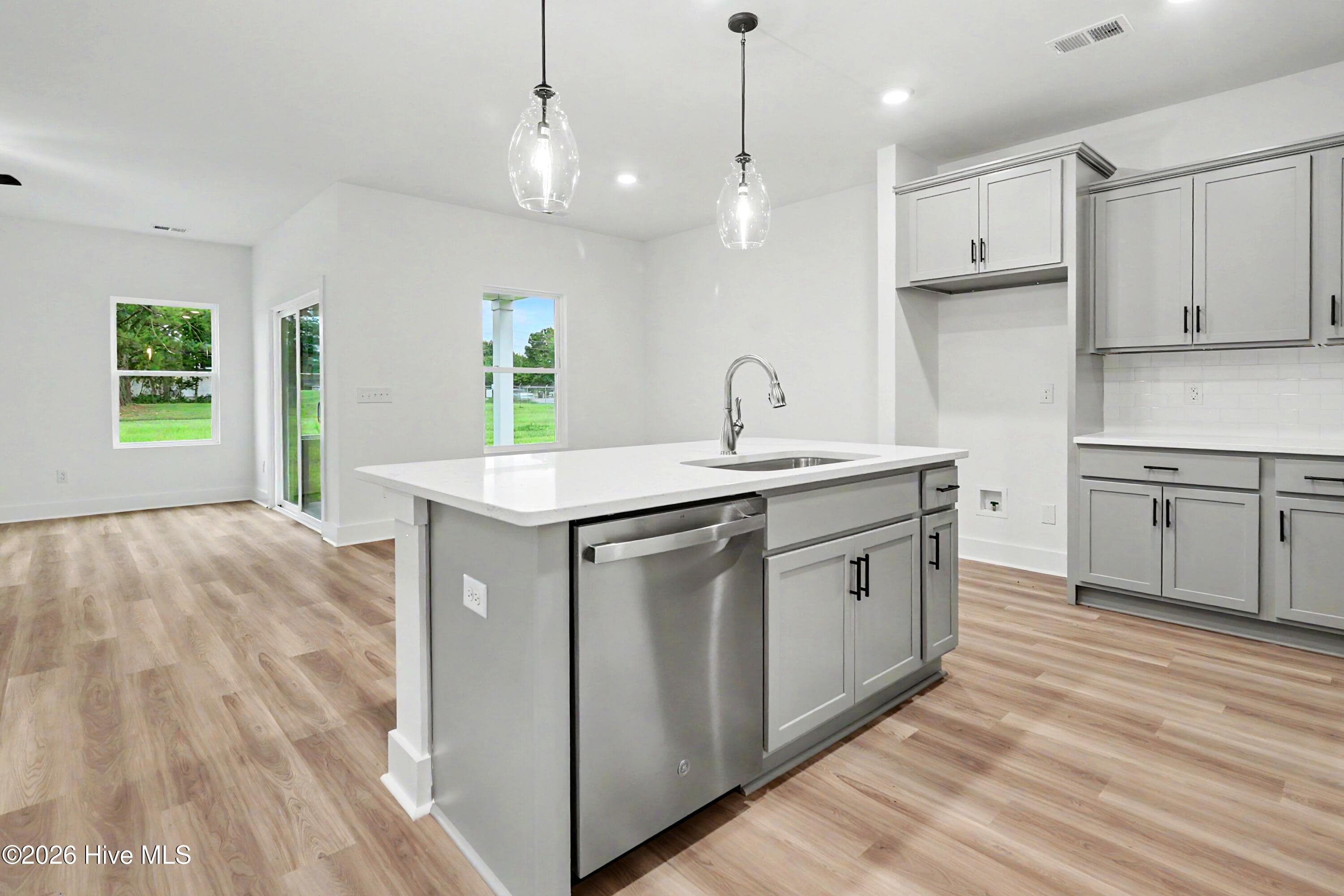 Kitchen open to Great Room and Dining Room - 2108 Cregan Cove SW (Lot 2), Ocean Isle Beach, NC 28469