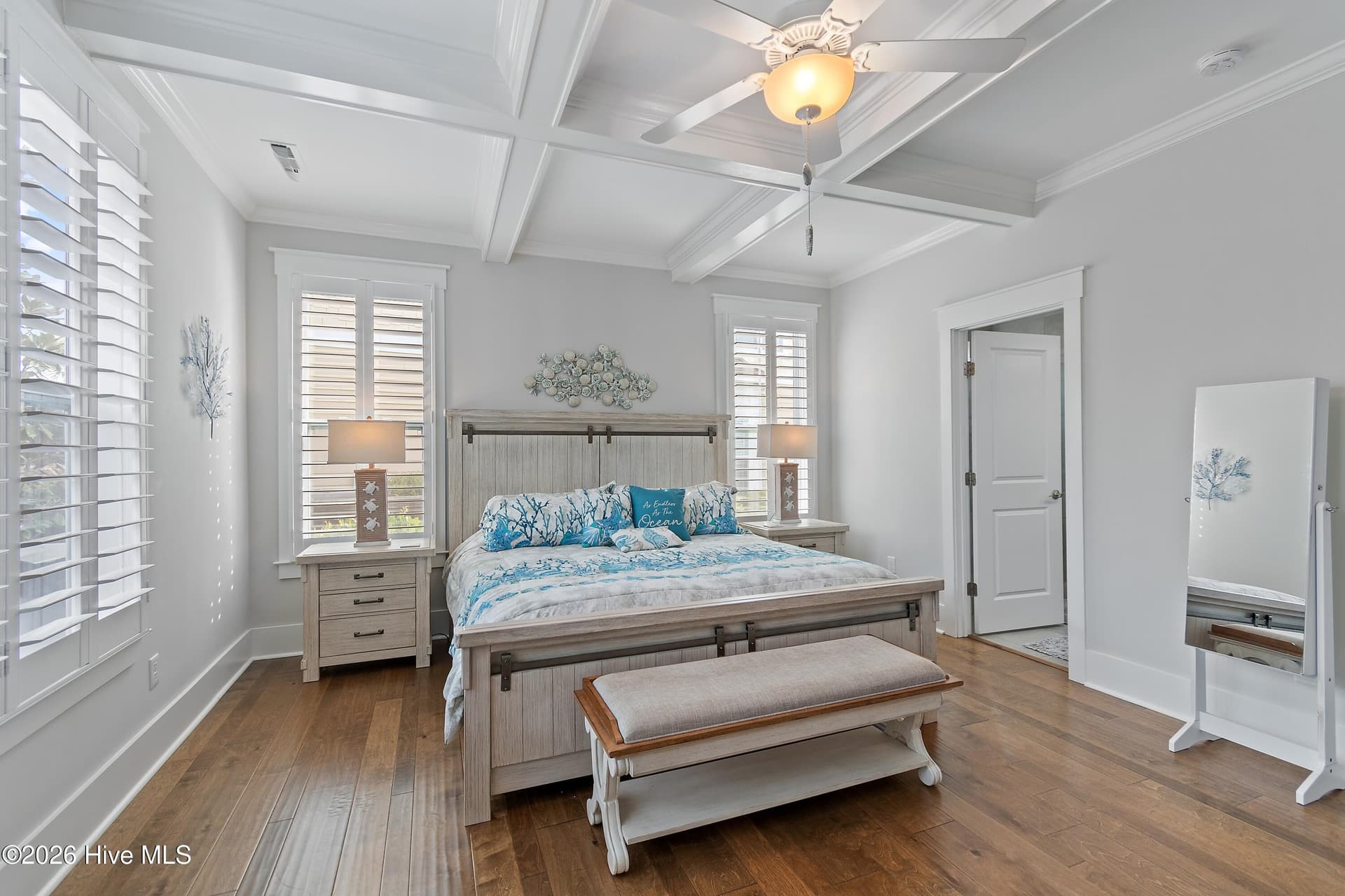 Primary bedroom with coffered ceiling. - 6358 Bryson Drive SW, Ocean Isle Beach, NC 28469