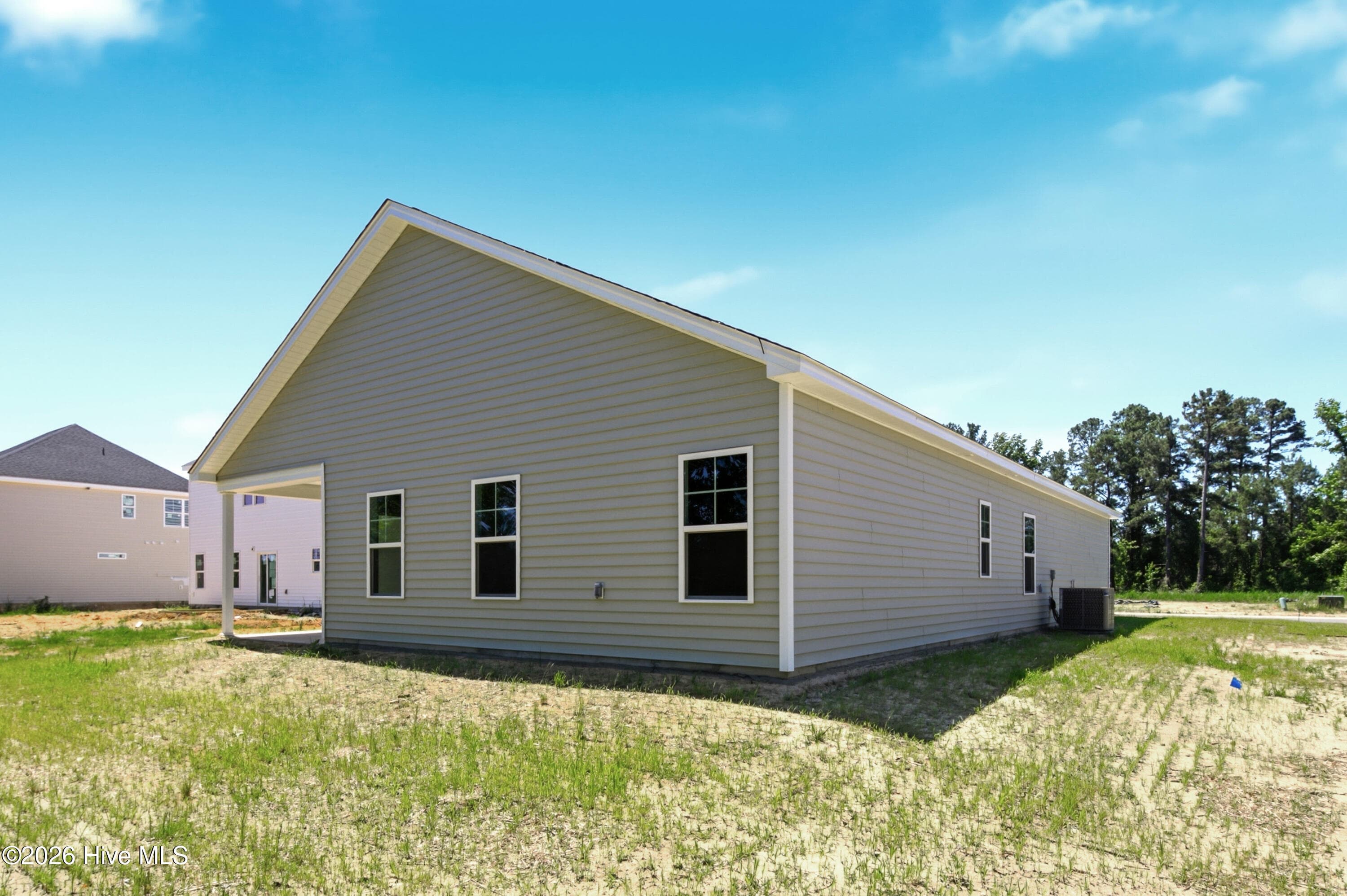 Example photo of similar home. Actual home is under construction and will feature a rear, Screened-in Covered Porch. - 4188 Workman Loop 89, Leland, NC 28451