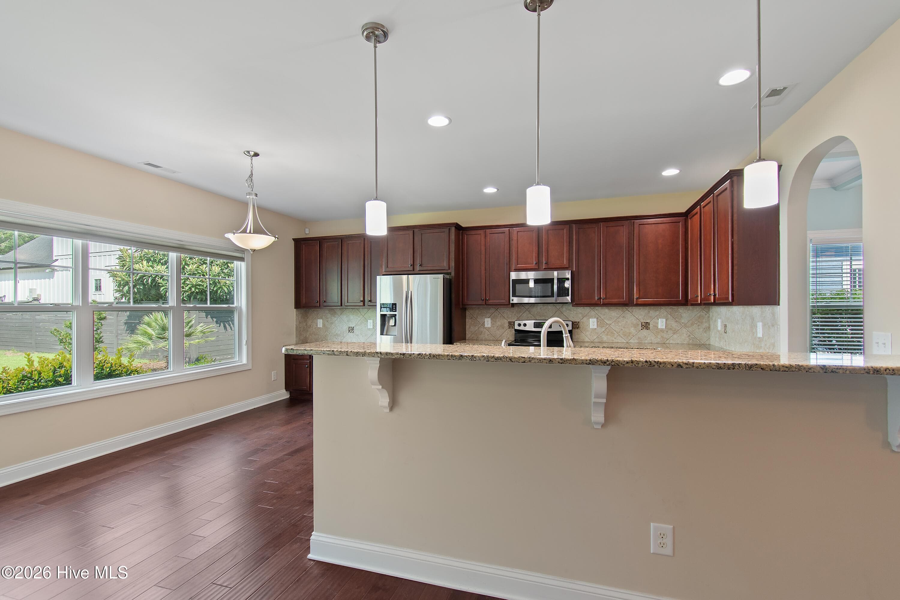 Notice all of the refined finishes throughout this home. Granite countertops, pendant lighting, recessed lighting. - 1674 Back Bay Drive SW, Shallotte, NC 28470