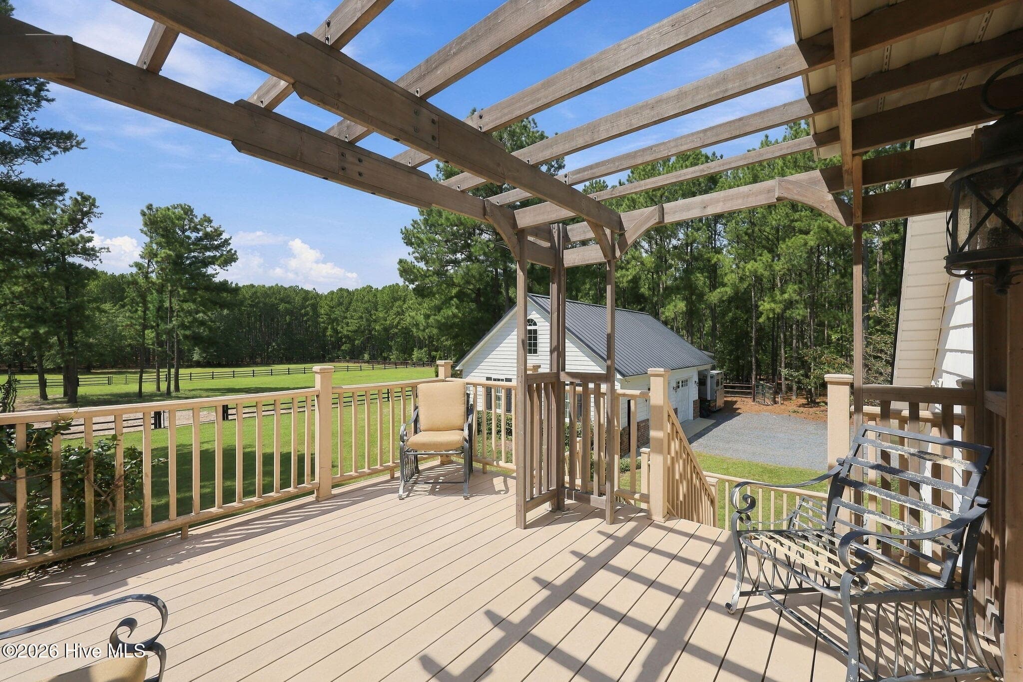 balcony with pergola overlooking pastures - 104 Meadows Lane, Aberdeen, NC 28315