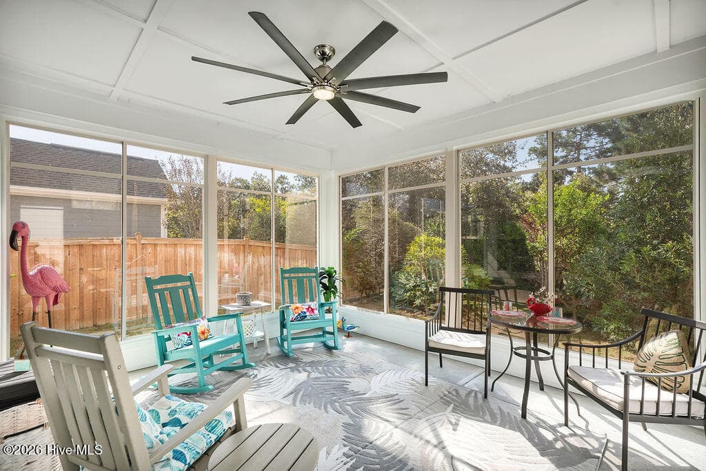 Take advantage of Wilmington’s greatest amenity, outdoor living, as you enjoy months of relaxation in the roomy enclosed 3-seasons room overlooking beautiful custom landscaping. - 142 Rice Marsh Way, Wilmington, NC 28412