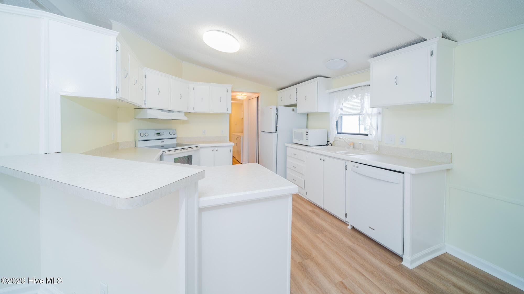 White on white is always in style and allows you to add and change your colors - 1076 Clubview Lane SW, Calabash, NC 28467