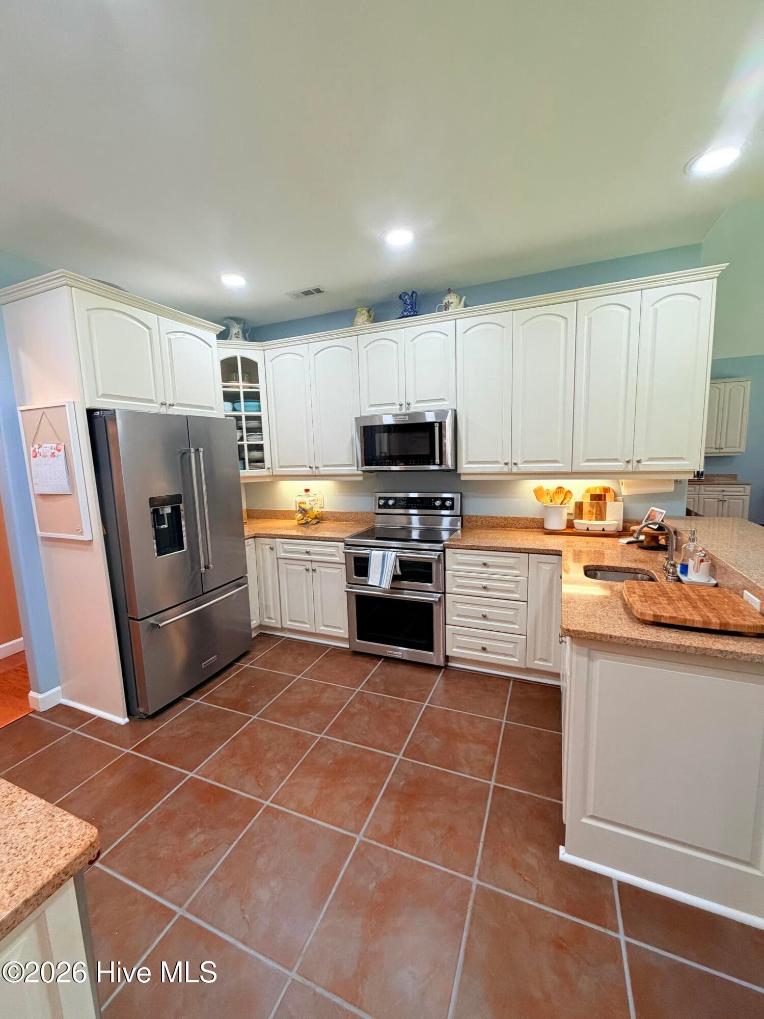 Kitchen has multiple counters and stations for prepping and entertaining - 1926 Snowy Egret Drive, Morehead City, NC 28557