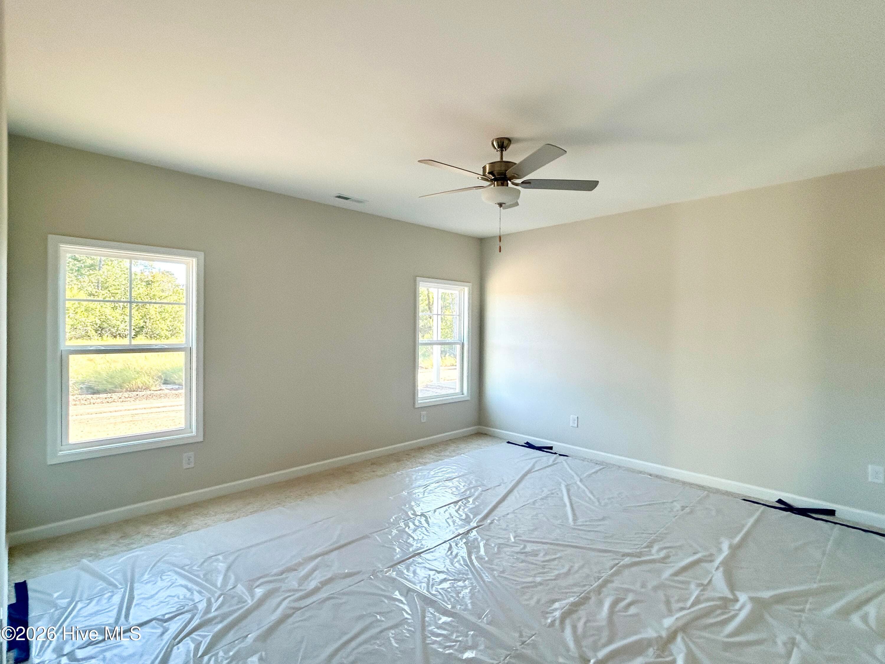 Primary suite features a Private Bathroom with Tile Shower and Large Walk-in Closet - 4192 Workman Loop 90, Leland, NC 28451