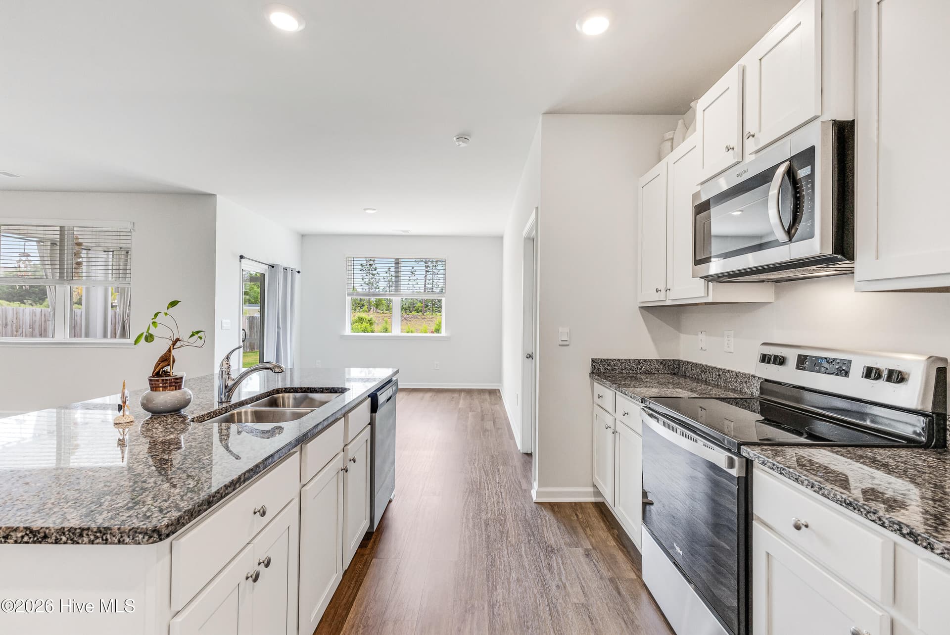 Kitchen with stainless steel appliances - 1038 Burled Oak Ridge Loop SE, Bolivia, NC 28422