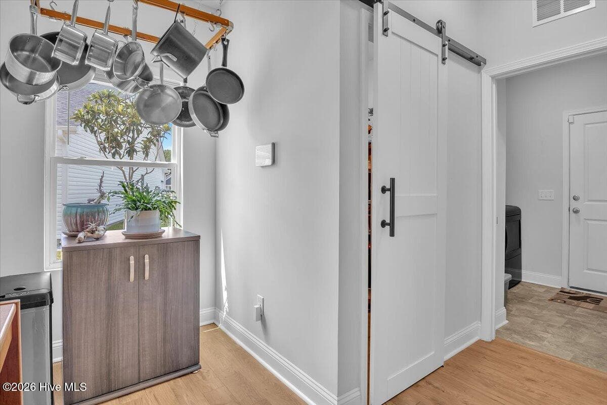 Butlers pantry-- sliding barn door on pantry - 1608 E New Carraway Place SE, Bolivia, NC 28422