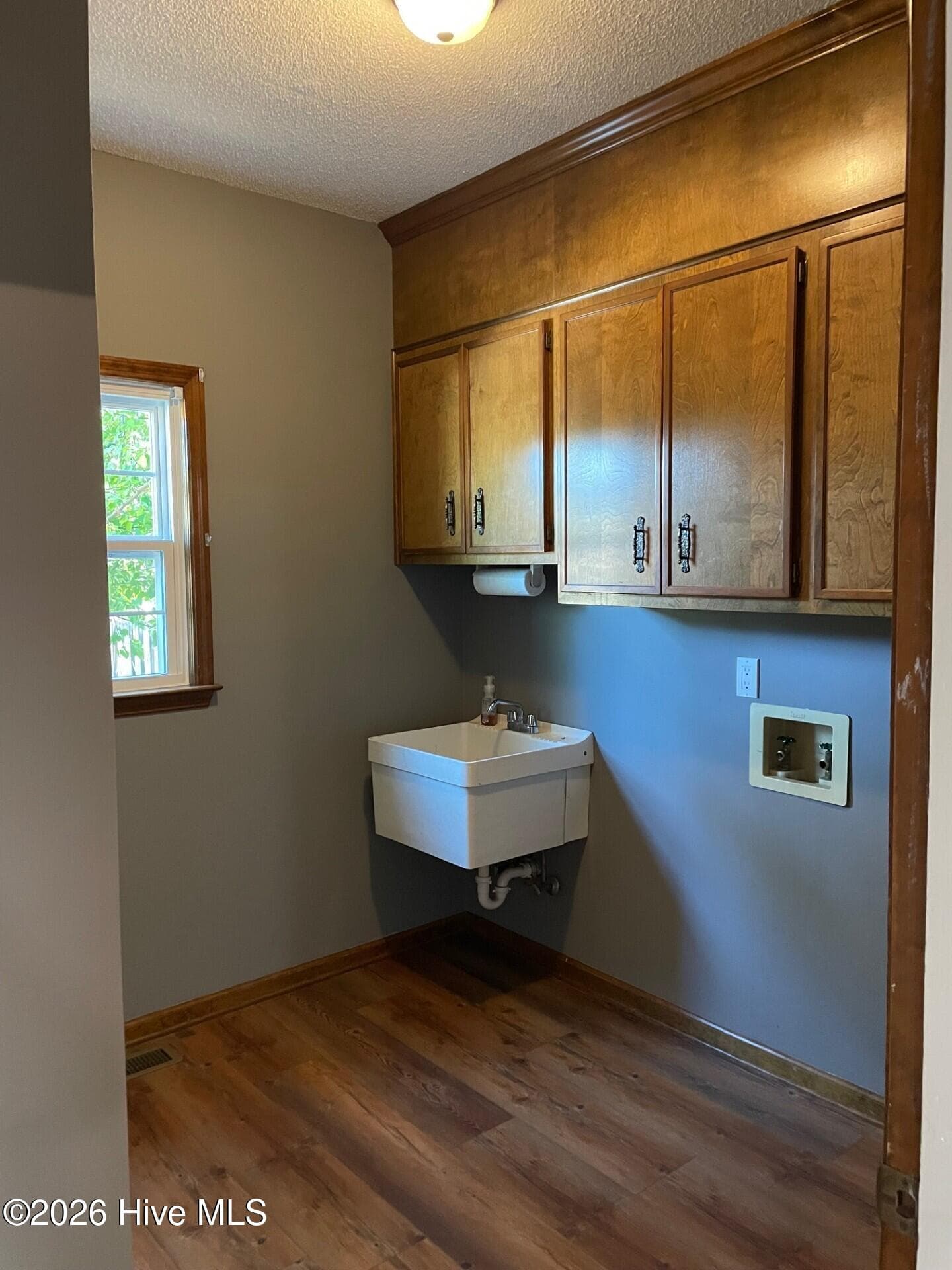 Laundry room off the kitchen with new flooring cbinets and shelving for pantry area. Beautiful barn door slider. - 4164 Quail Springs Circle, Augusta, GA 30907