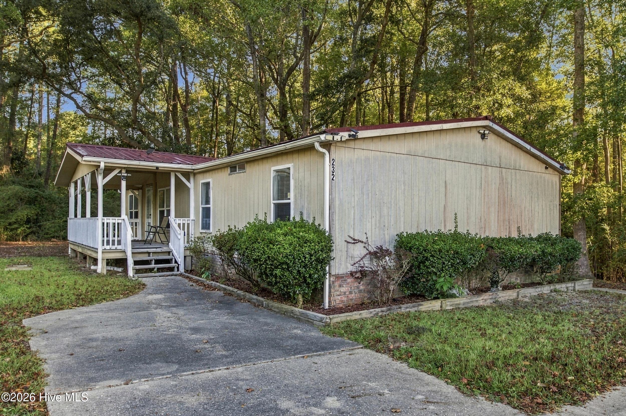 Manufactured Home at 232 Suburban Street SW, Shallotte, NC 28470, photo 2 of 40