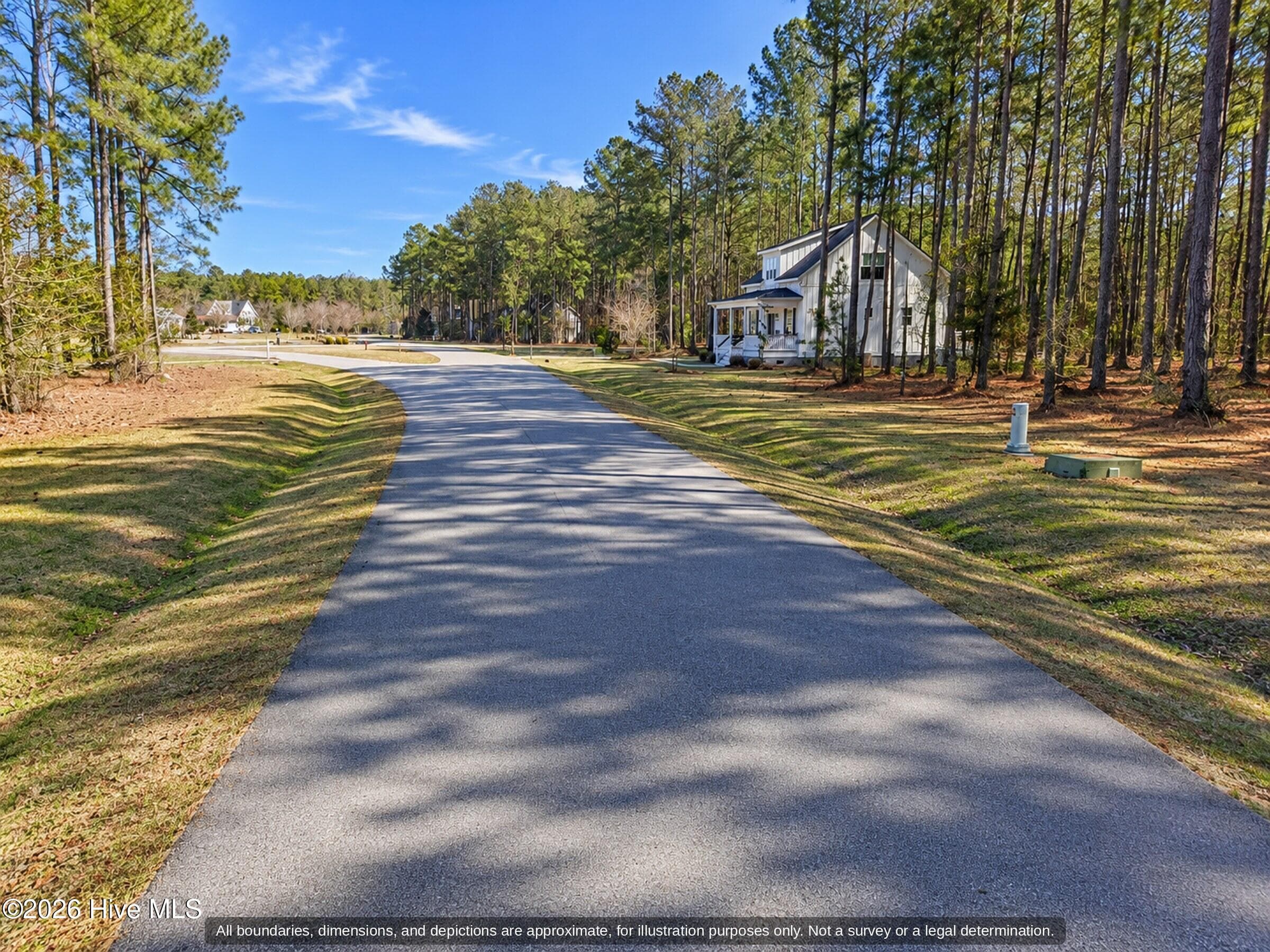 Paved private street with homes in Arlington Place, a gated community near Oriental NC - 0000-0000 LOT 83 Mill Creek Drive, Minnesott Beach, NC 28510