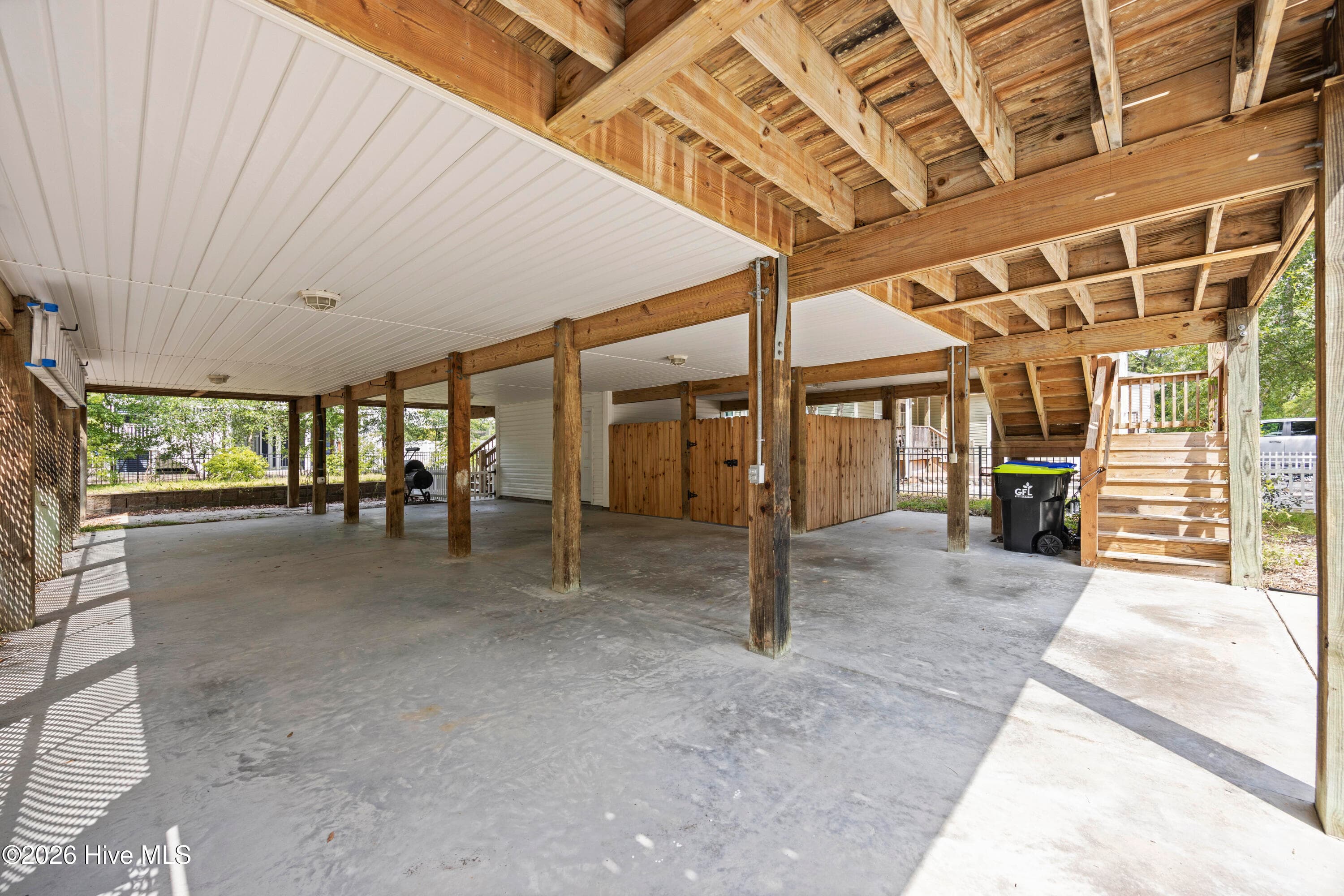 COVERED PARKING on ground level, looking toward Storage Room and Lockup Area - 225 NE 39th Street, Oak Island, NC 28465