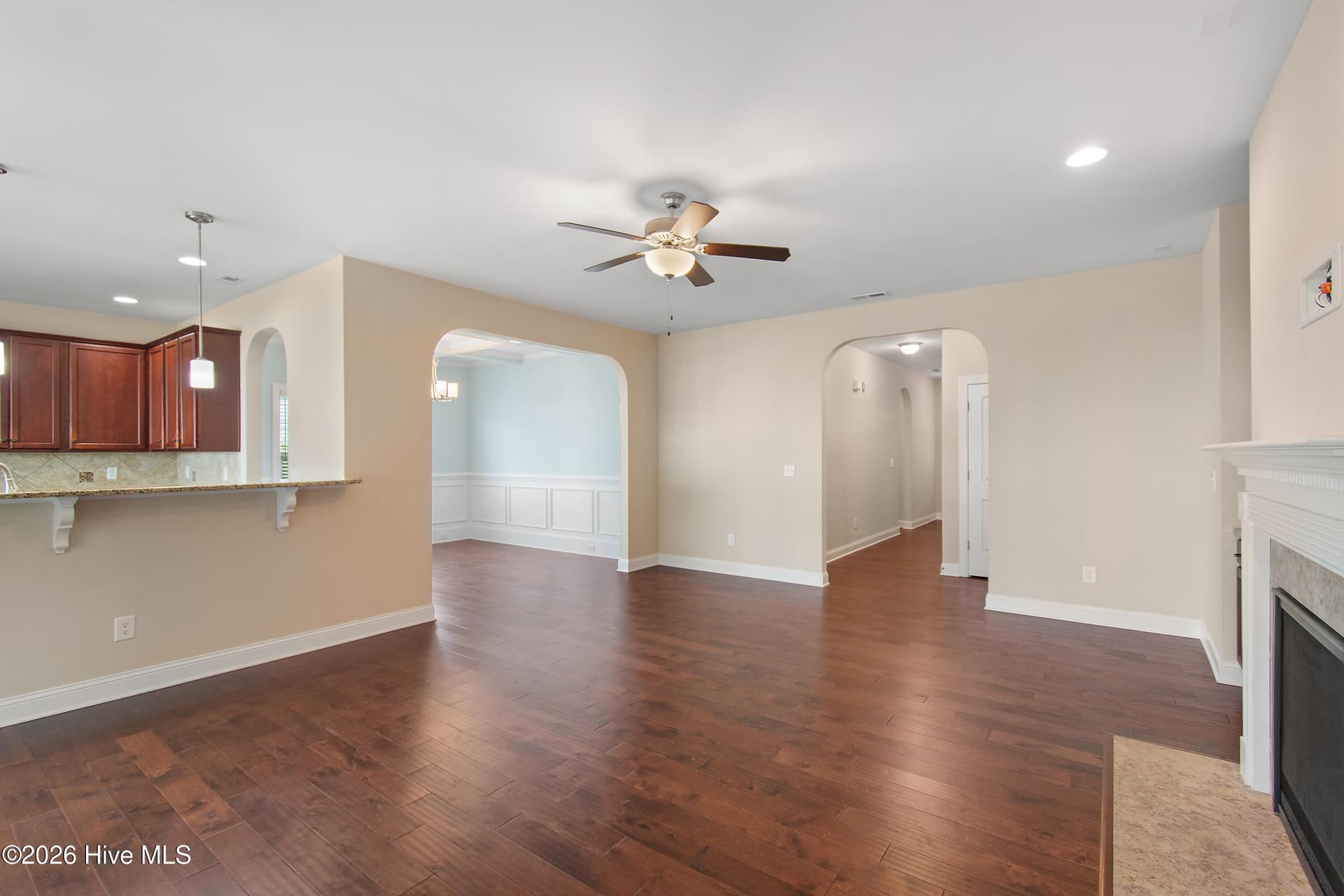 Living room is open to the kitchen and dining room. - 1674 Back Bay Drive SW, Shallotte, NC 28470