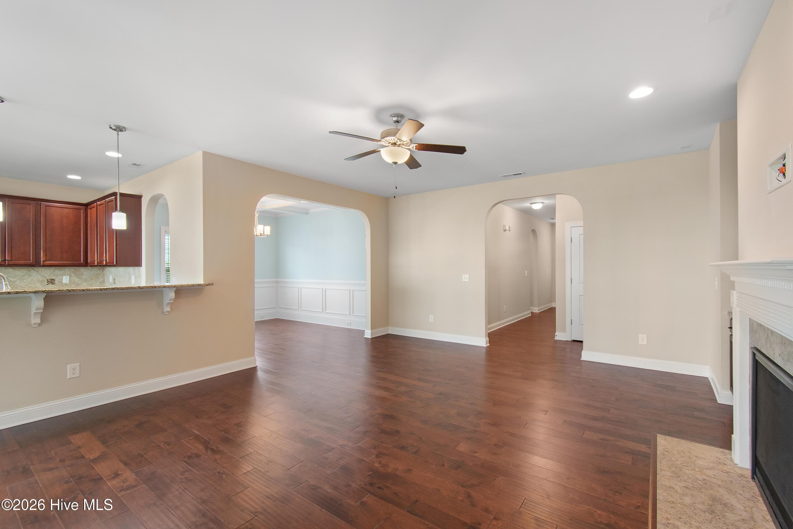 Living room is open to the kitchen and dining room. - 1674 Back Bay Drive SW, Shallotte, NC 28470