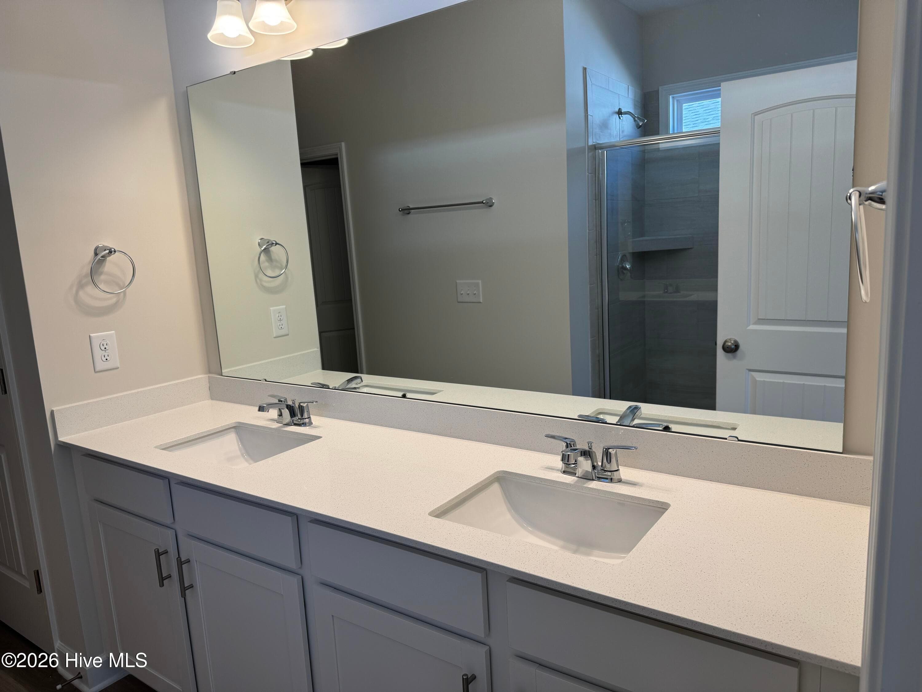 Primary suite features a Private Bathroom with Tile Shower and Large Walk-in Closet - 4145 Workman Loop 66, Leland, NC 28451