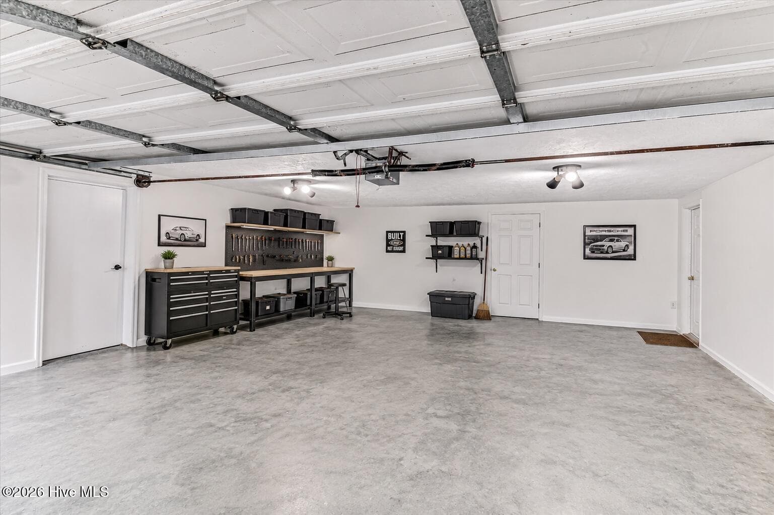 A spacious garage with plenty of room for parking, storage, hobbies, or a dedicated workshop setup. - 16 Rapids Court, North Augusta, SC 29841