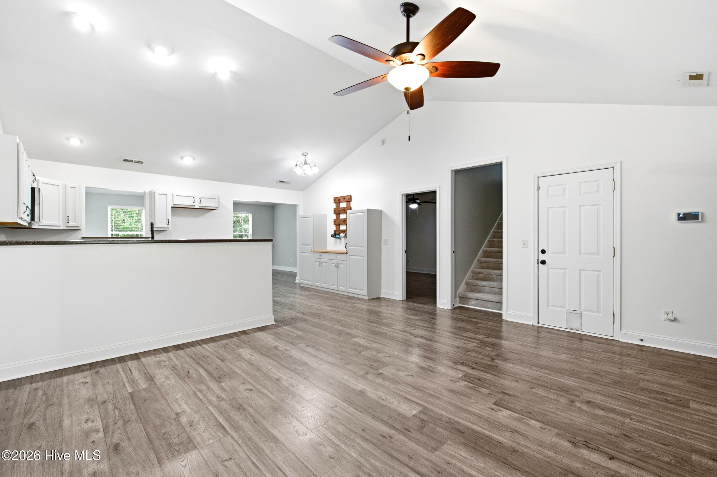Living room overlooking the kitchen - 122 Pond View Circle, Hampstead, NC 28443