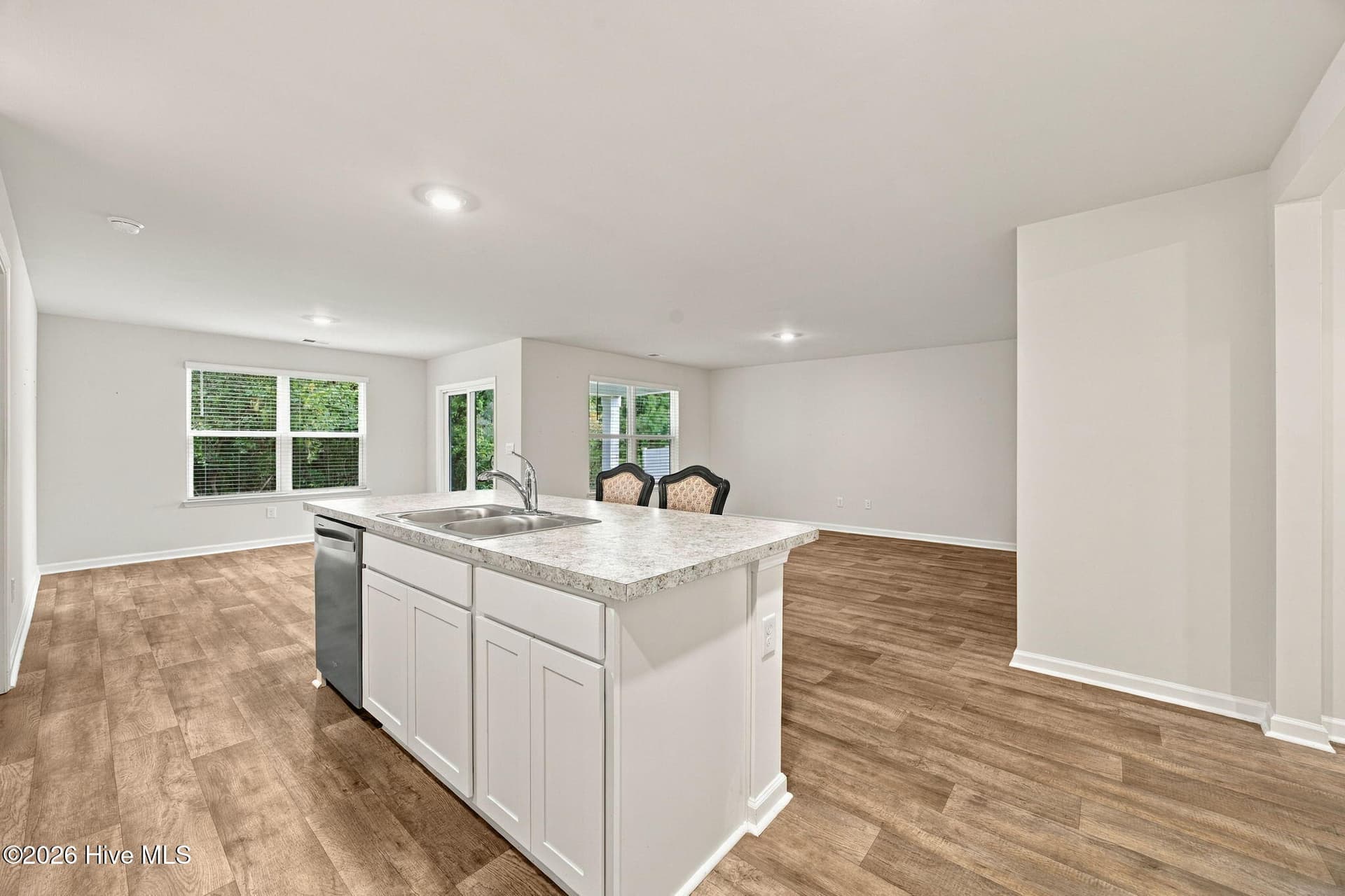 Kitchen looking into living room (right) and dining area (left). - 2991 Hardsmith Street, Shallotte, NC 28470