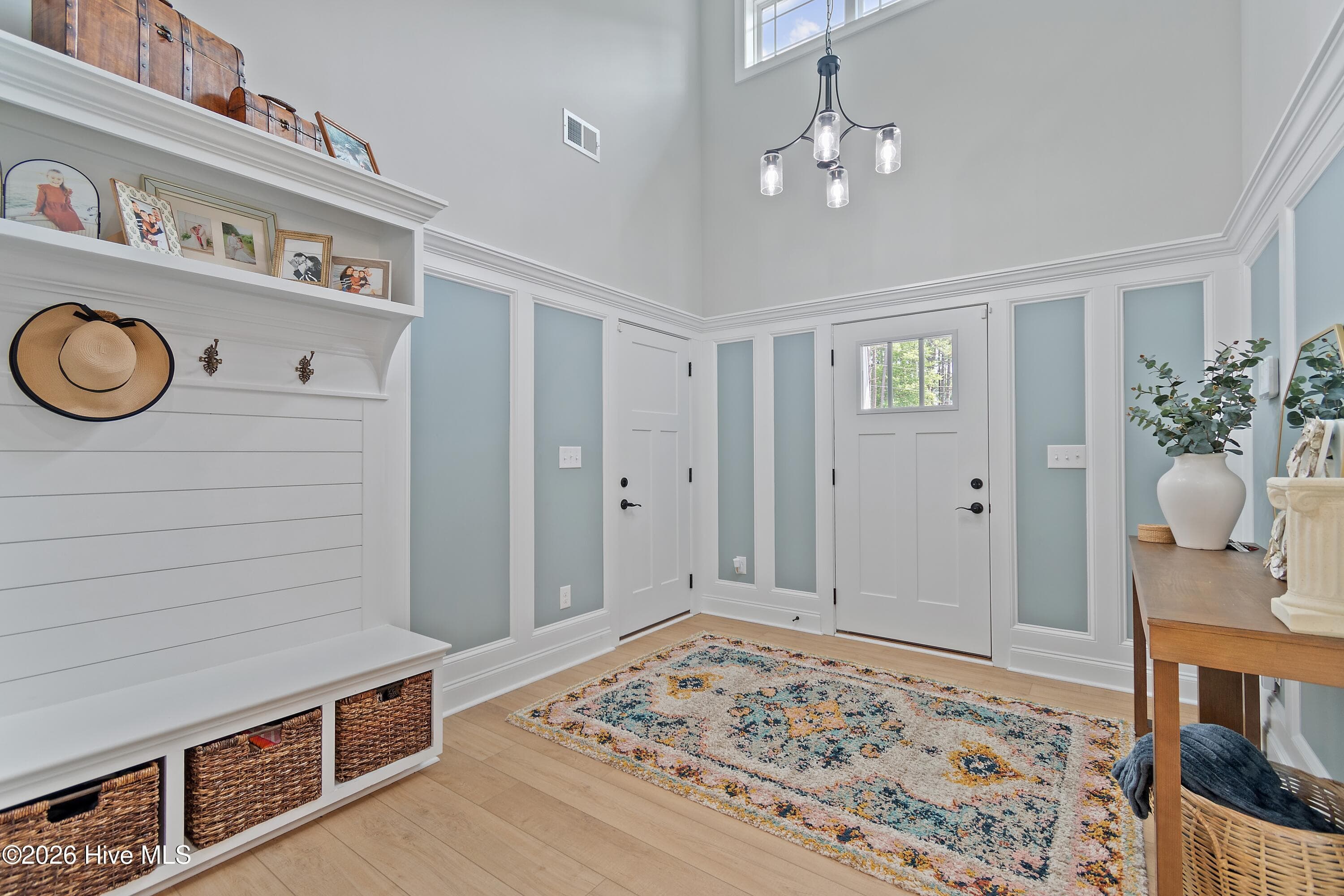 Large foyer with bench, storage and beautiful shiplap accents. - 299 Boundaryline Drive NW, Calabash, NC 28467
