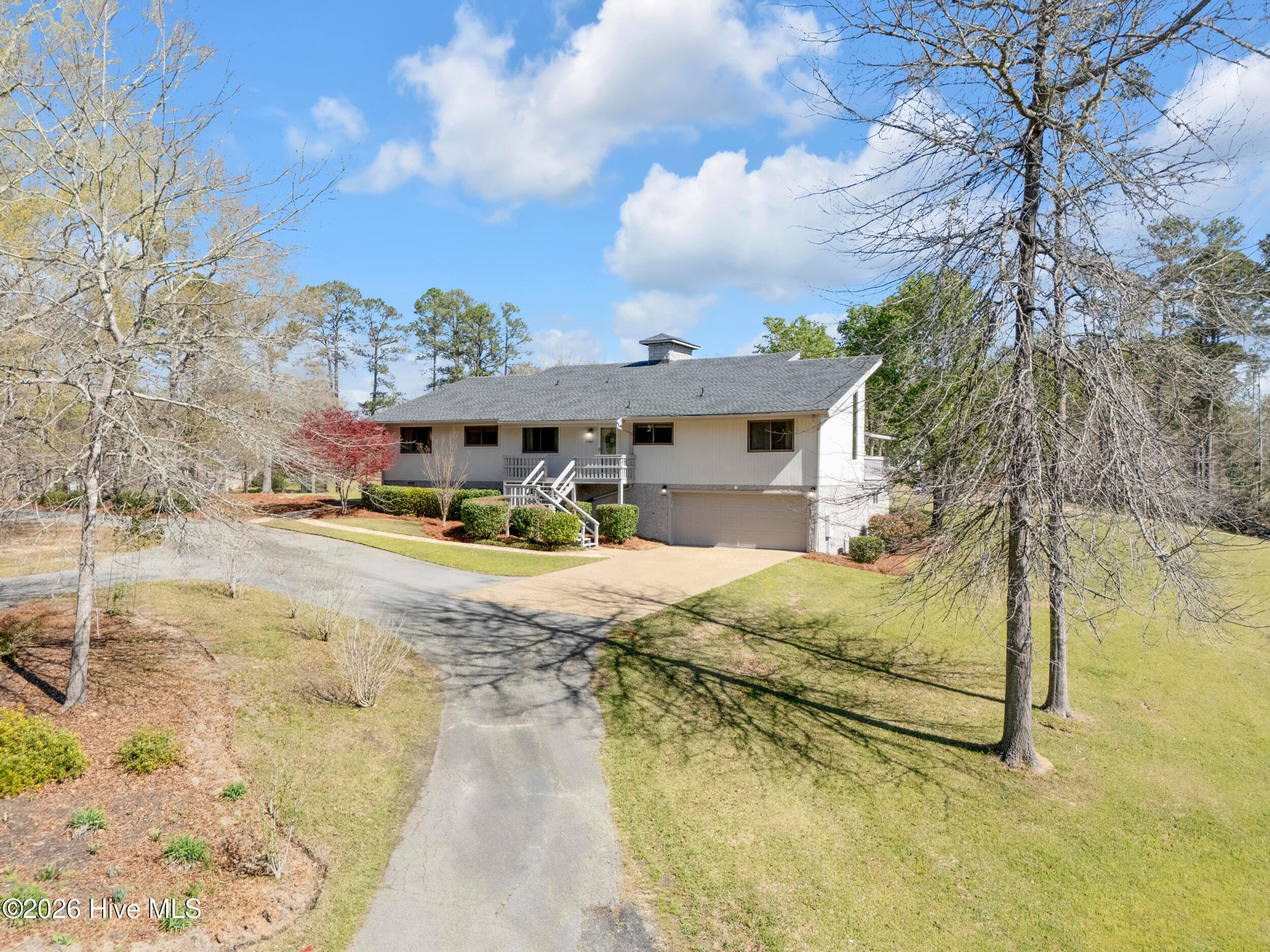 Car entry area and two car enclosed garage with basement storage - 401 S Lake Drive, Thomson, GA 30824