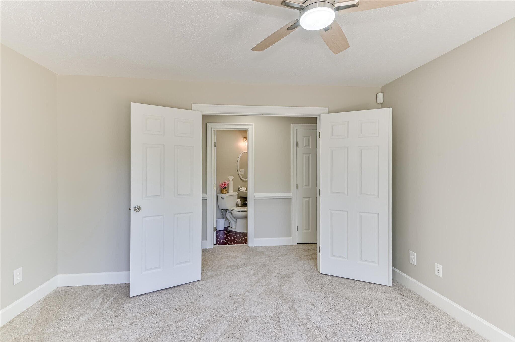 French doors into the downstairs bedroom/office/playroom - 1154 Water Oak Drive, Lincolnton, GA 30817