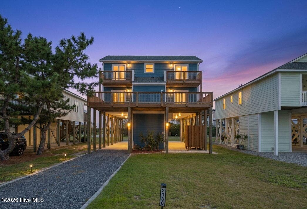 Rear exterior at twilight - 2330 W Beach Drive, Oak Island, NC 28465