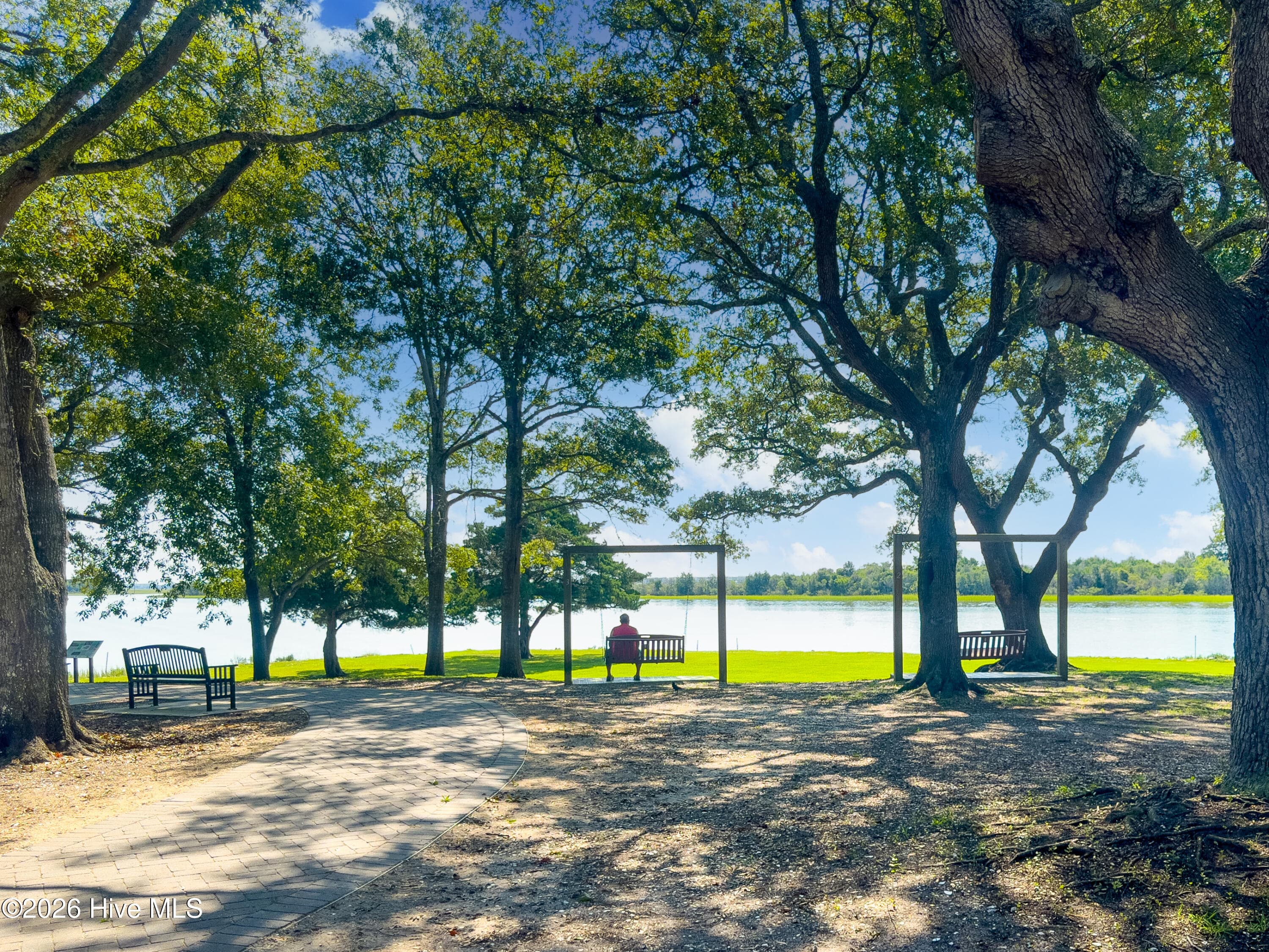 Nearby Park with Shaded Walking Trails and swings overlooking the waterway - 908 Resort Circle Unit 203, Sunset Beach, NC 28468
