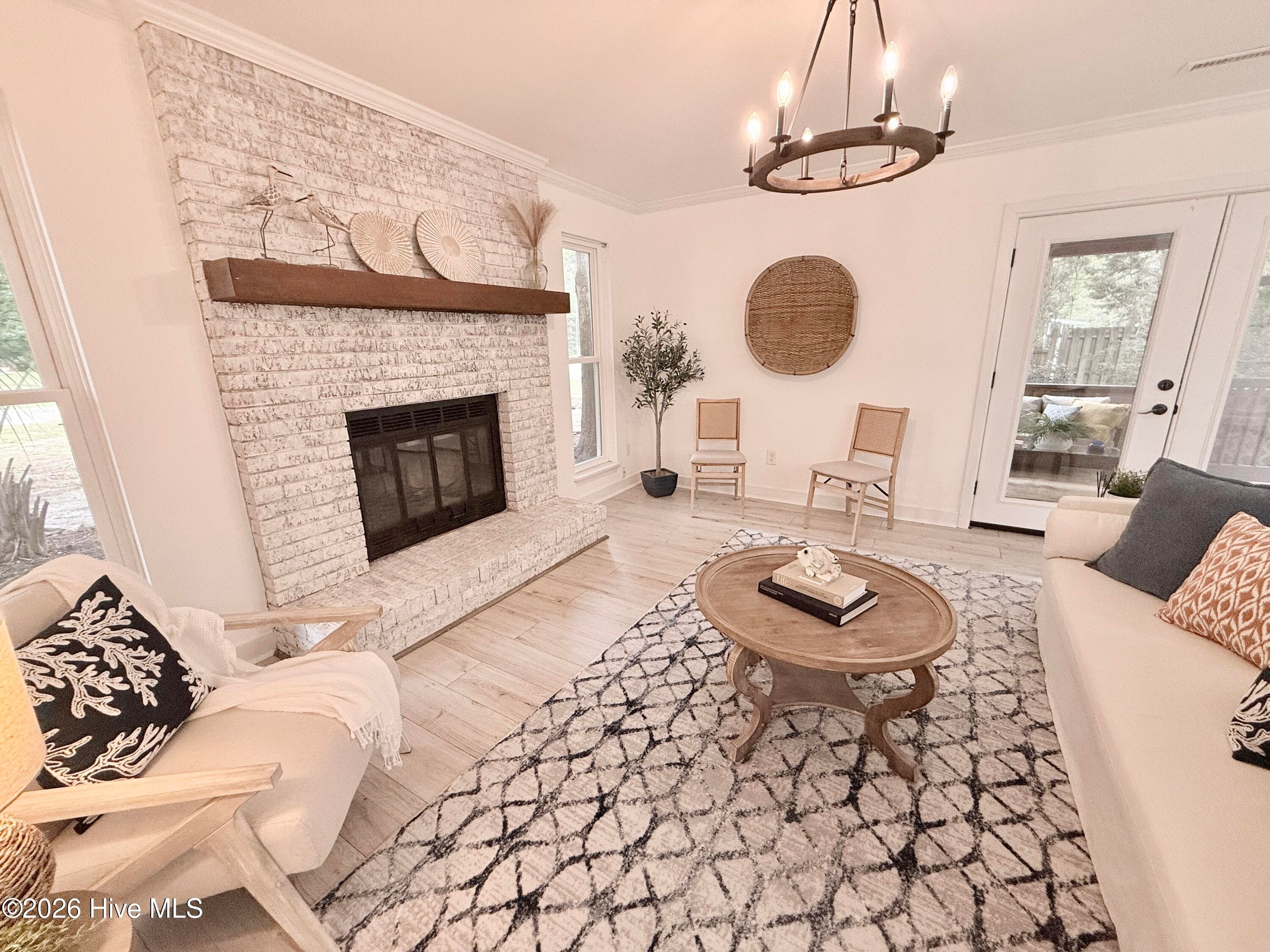 French doors lead out to the screened in porch - 1001 Hunting Ridge Road, Wilmington, NC 28412