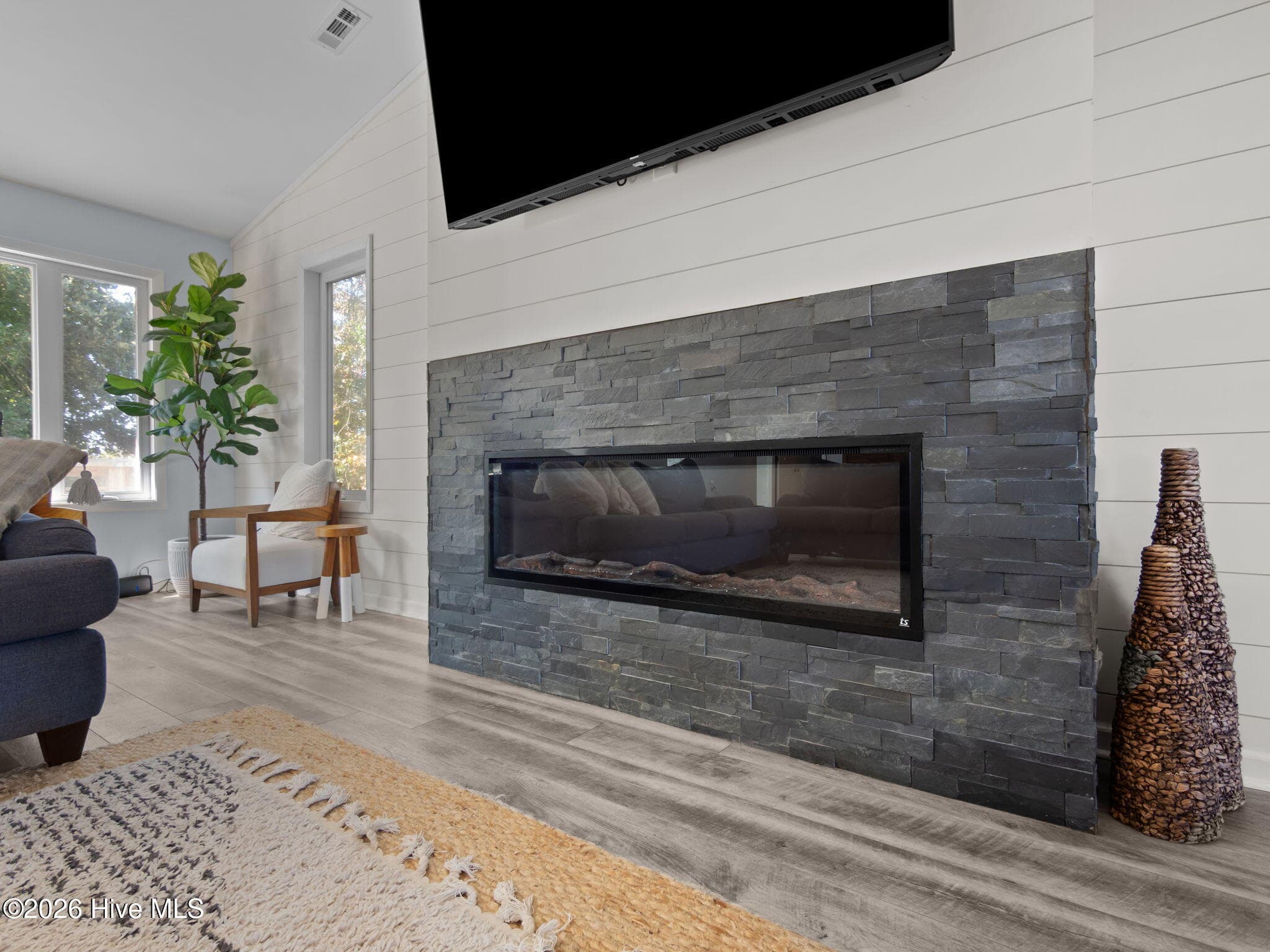 Electric Fireplace & Big Screen TV on Shiplap Dressed Wall - 5415 Cedar Tree Lane, Emerald Isle, NC 28594