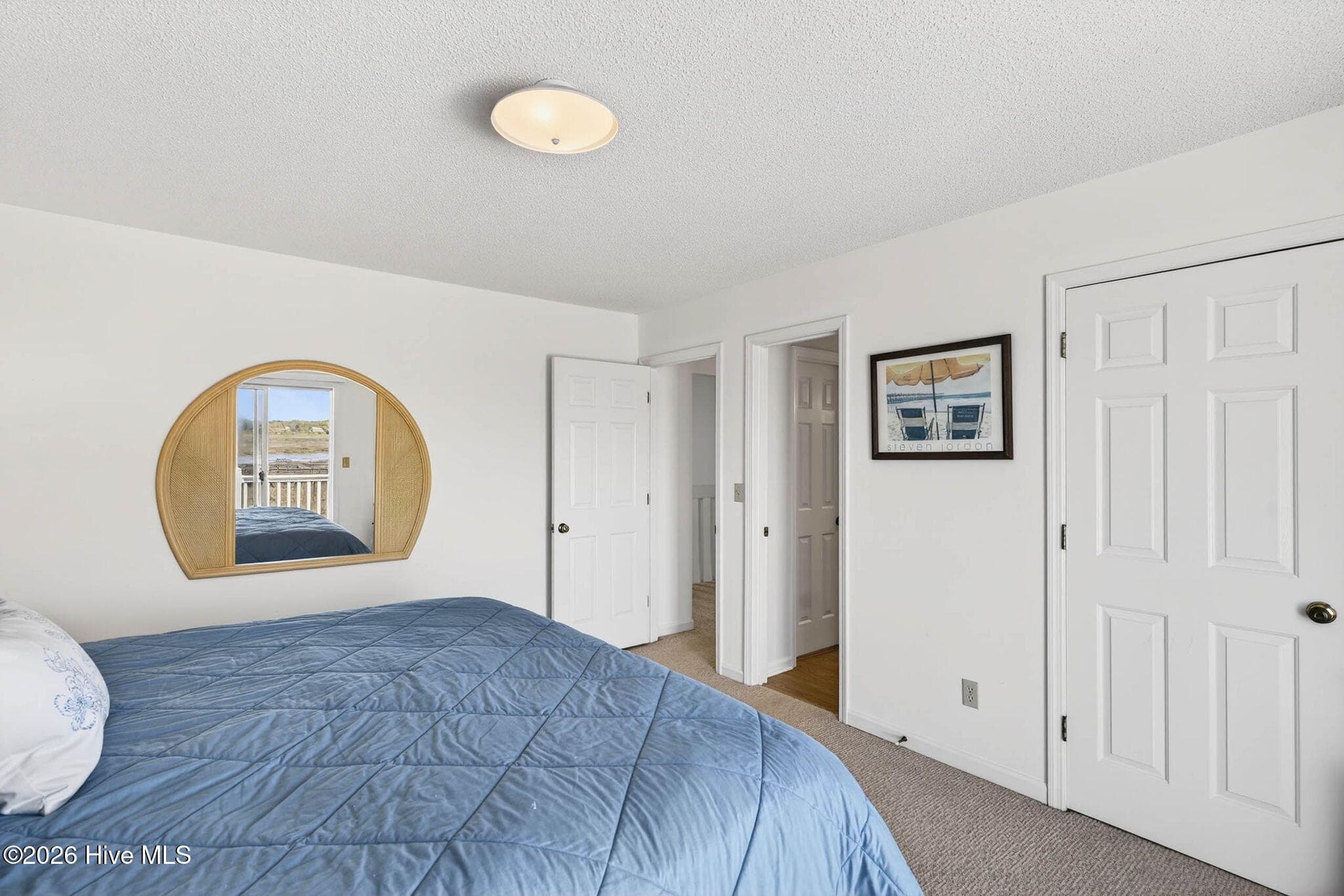 Bedroom with generous closet space and functional layout. - 1206 N Shore Drive W, Sunset Beach, NC 28468