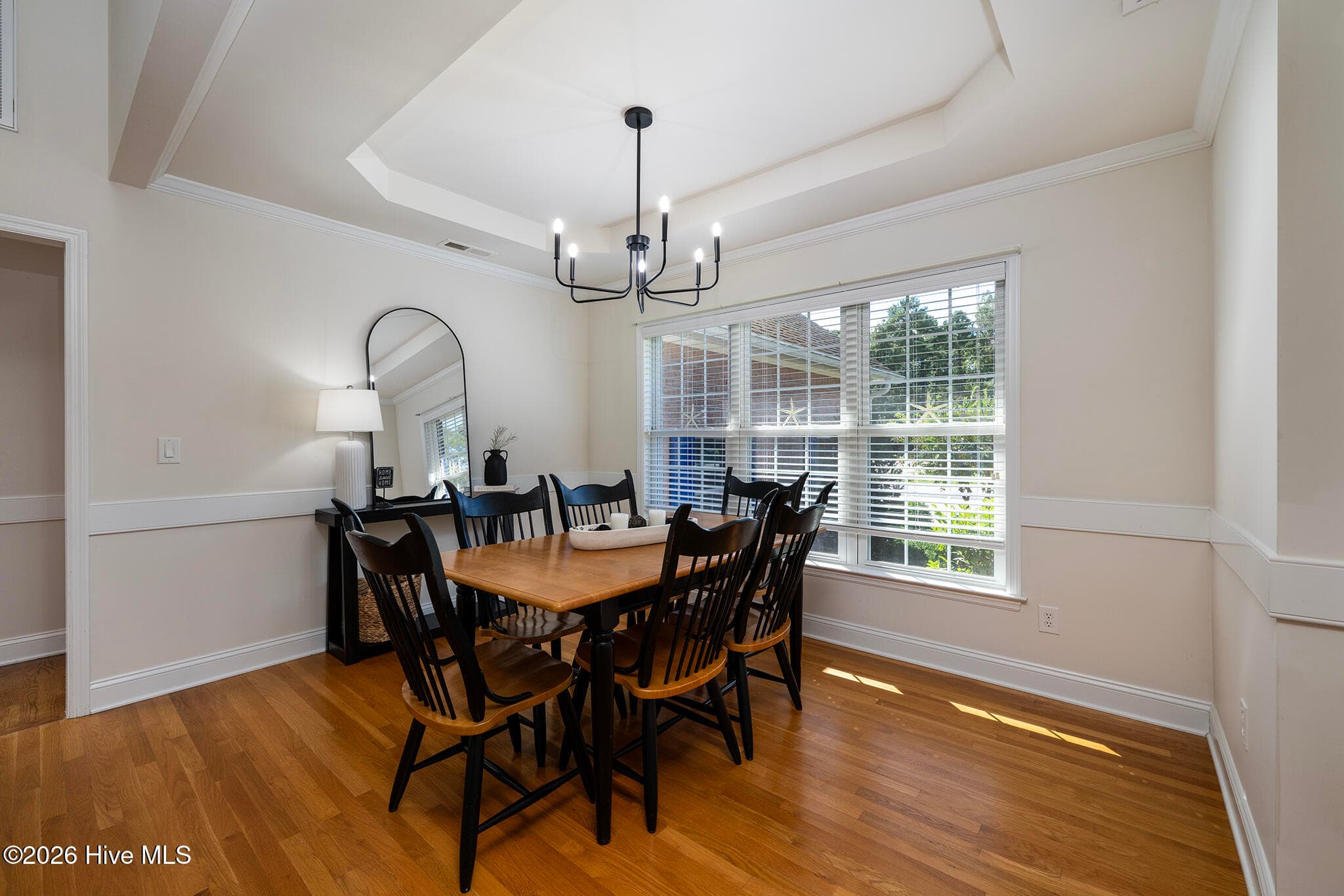 Formal Dining Room with a Tray Ceiling and Chair Railing - 5505 Blackbeard Lane, New Bern, NC 28560