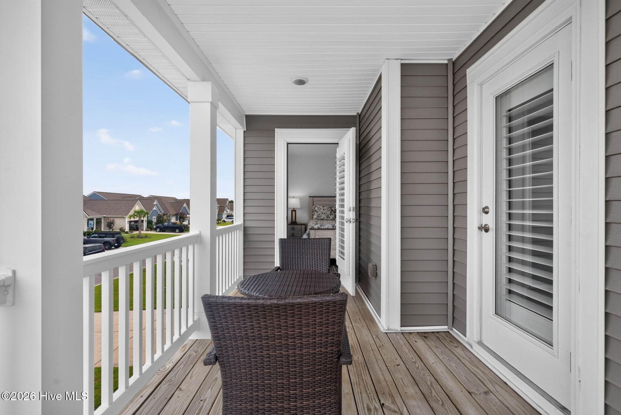 The covered upper-level balcony creates a peaceful place to relax and enjoy the coastal Carolina air. - 139 Eagle Claw Drive, Calabash, NC 28467