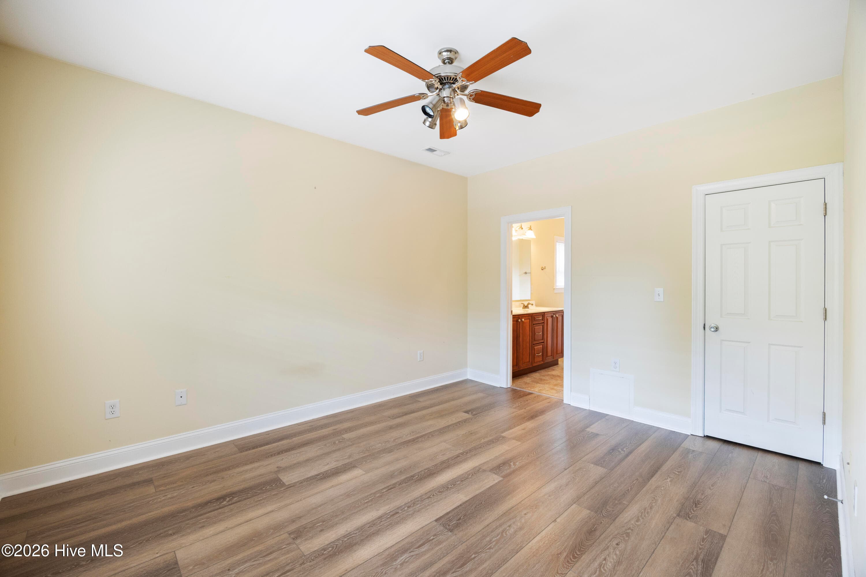 PRIMARY BEDROOM with En Suite Bathroom and Walk-In Closet - 225 NE 39th Street, Oak Island, NC 28465