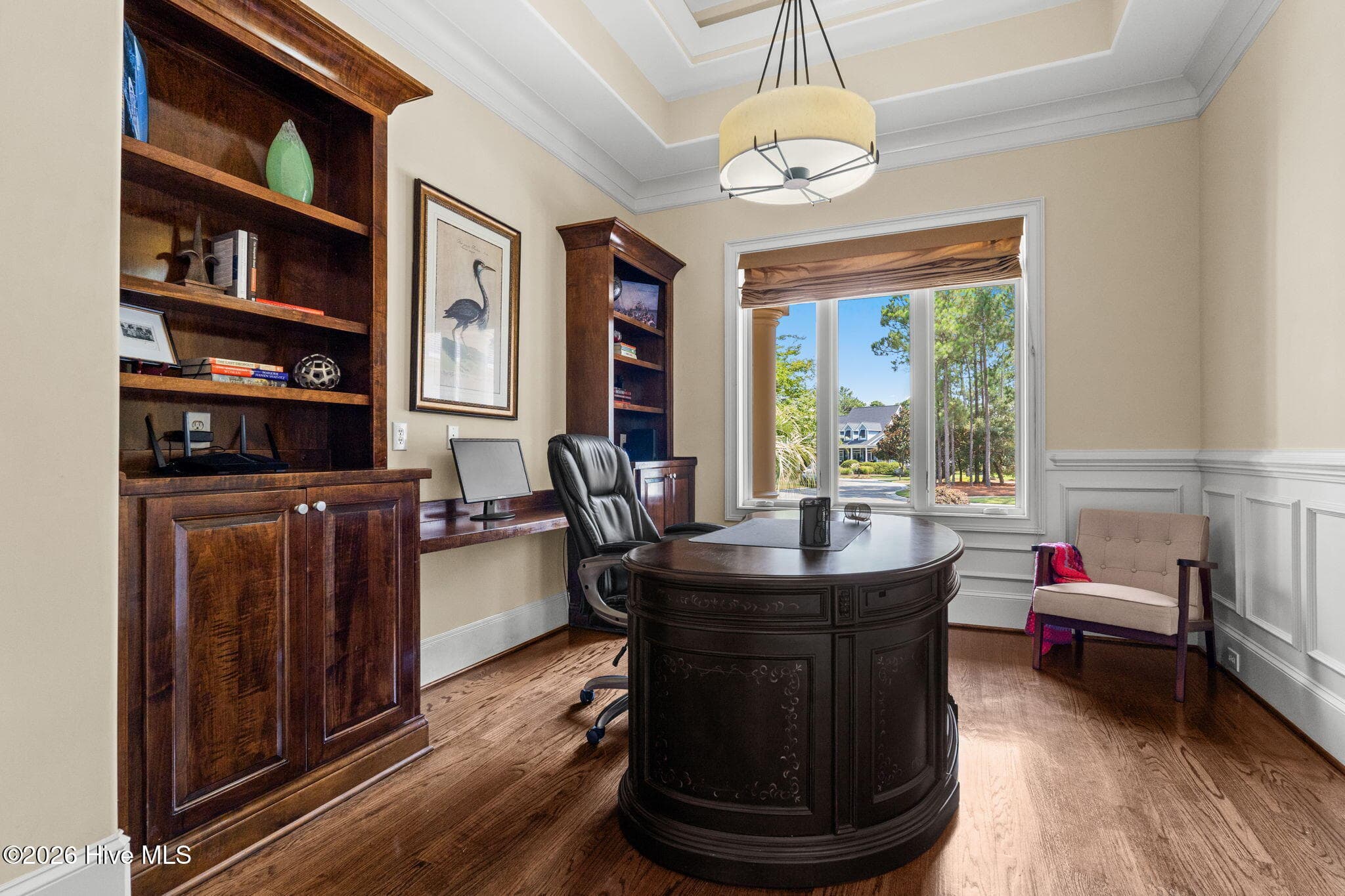 Private office with gleaming hardwood floors and built ins. - 3858 Ridge Crest Drive, Southport, NC 28461