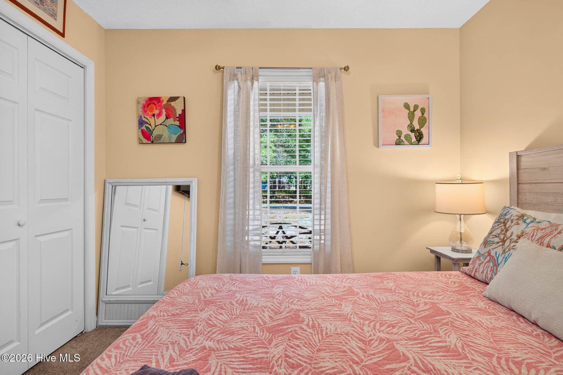 Additional view of the guest bedroom showcasing its comfortable size and coastal-inspired feel. - 1650 Frink Street SW, Ocean Isle Beach, NC 28469