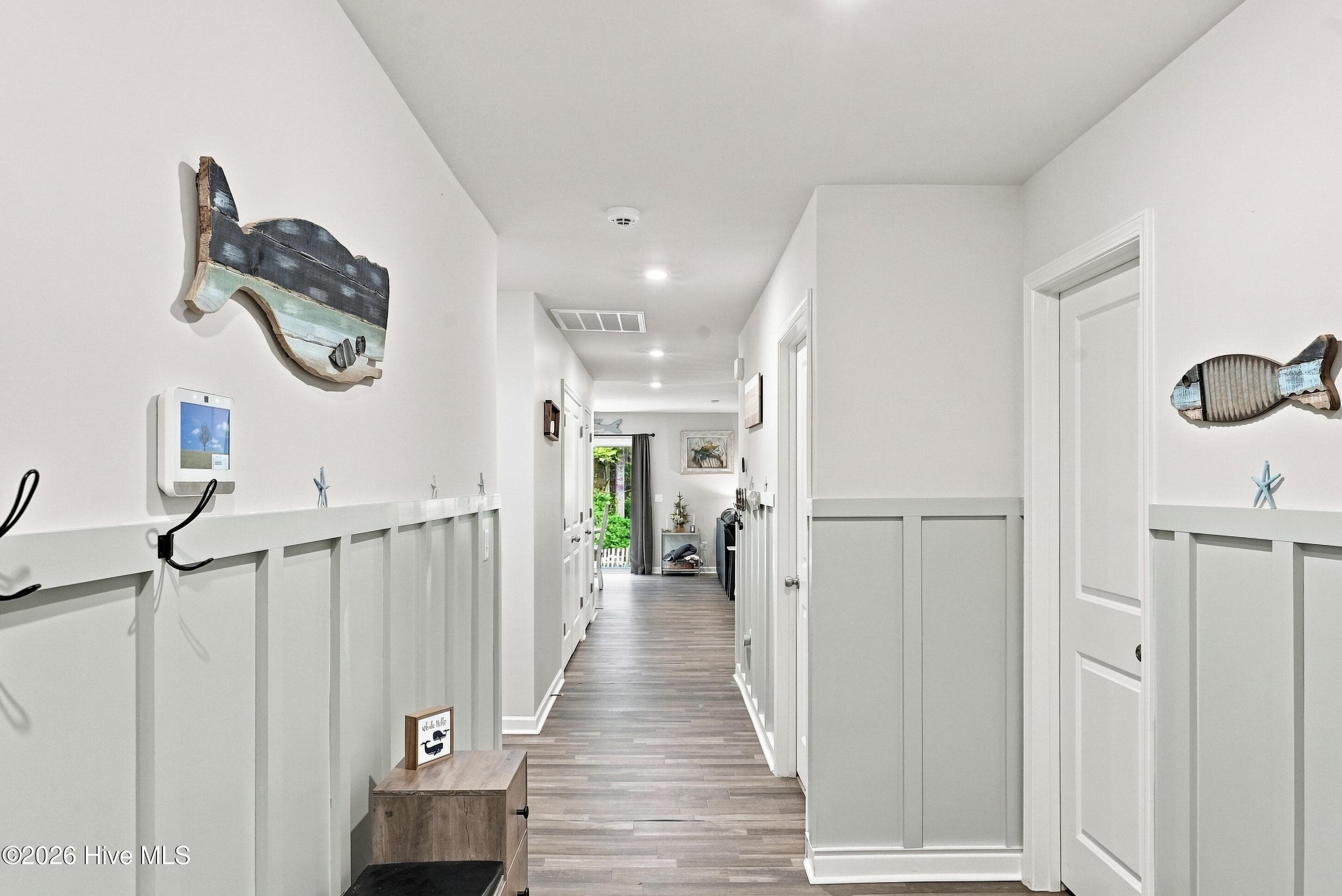 HALLWAY WITH WAINSCOATING - 2519 Sendero Drive SE, Bolivia, NC 28422