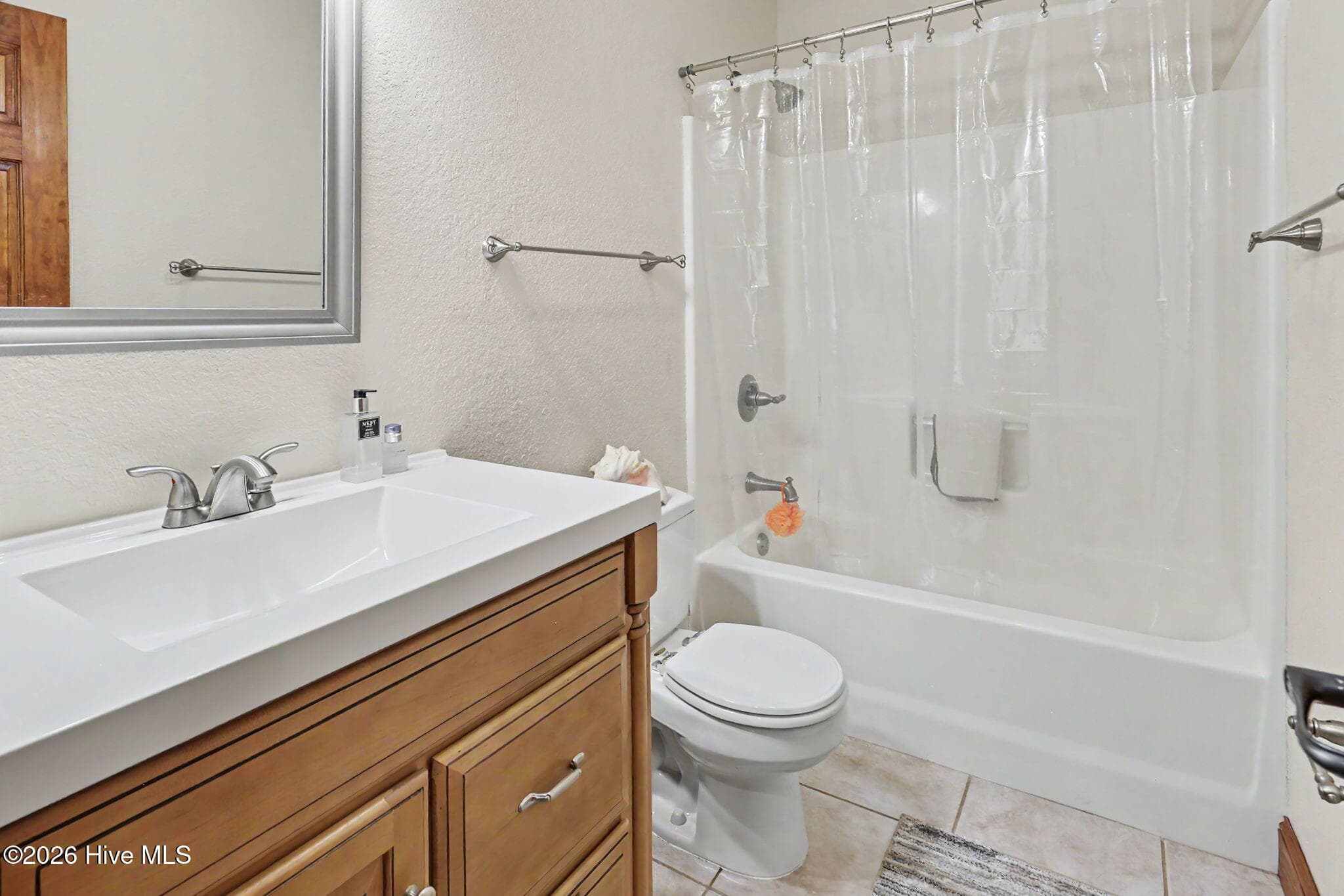 Full lower-level bath serves the bedrooms and separate living area. - 210 Majestic Drive, Hayesville, NC 28904
