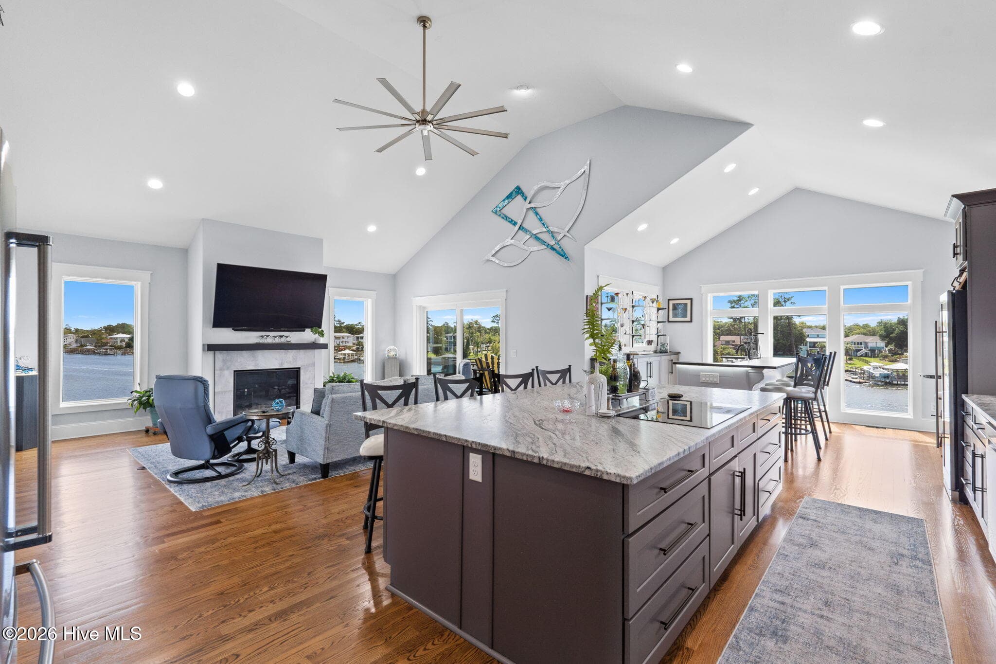 Complete open floor plan to bar and living room providing the ultimate space for entertaining - 2775 Long Bay Drive SE, Southport, NC 28461