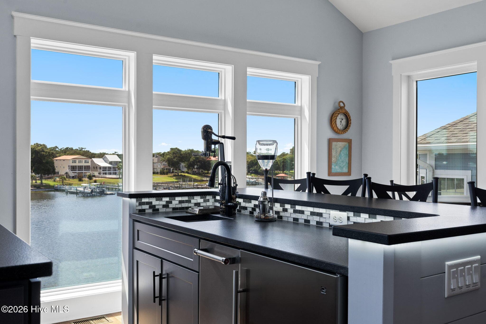 Bar includes beverage refrigerator and separate ice machine with undercounter lighting - 2775 Long Bay Drive SE, Southport, NC 28461